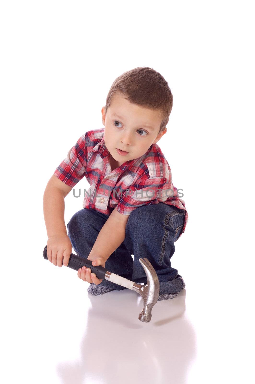 Cute little boy with a hammer