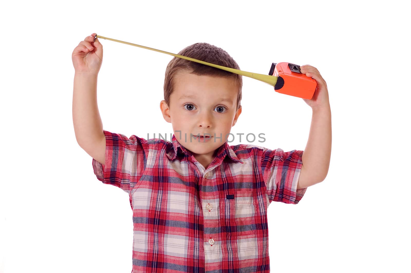 Cute little boy with a measuring tape