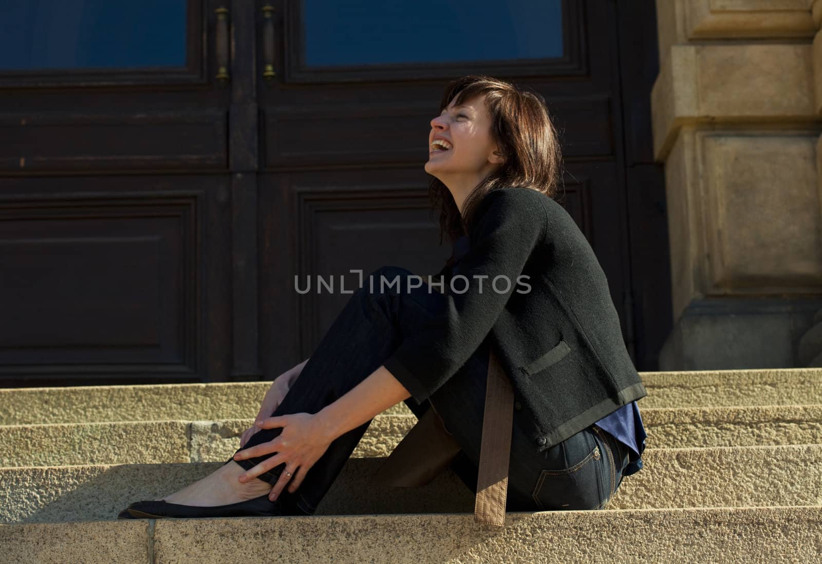 young woman sitting on the steps