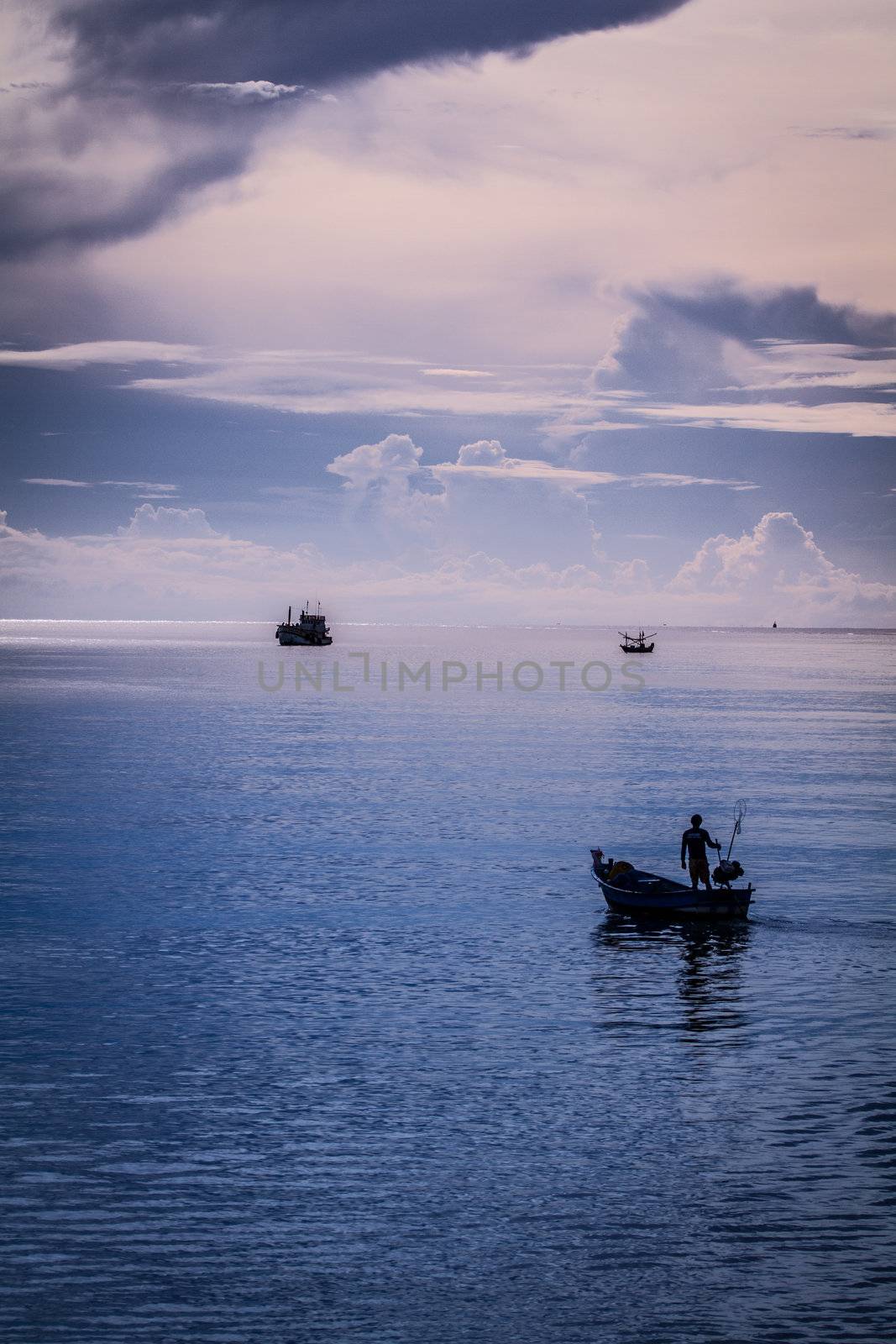 fisher man driving boat to the sea