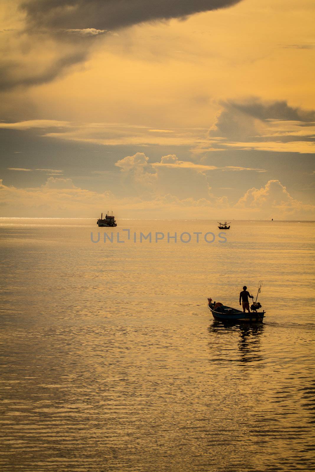 fisher man driving boat to the sea