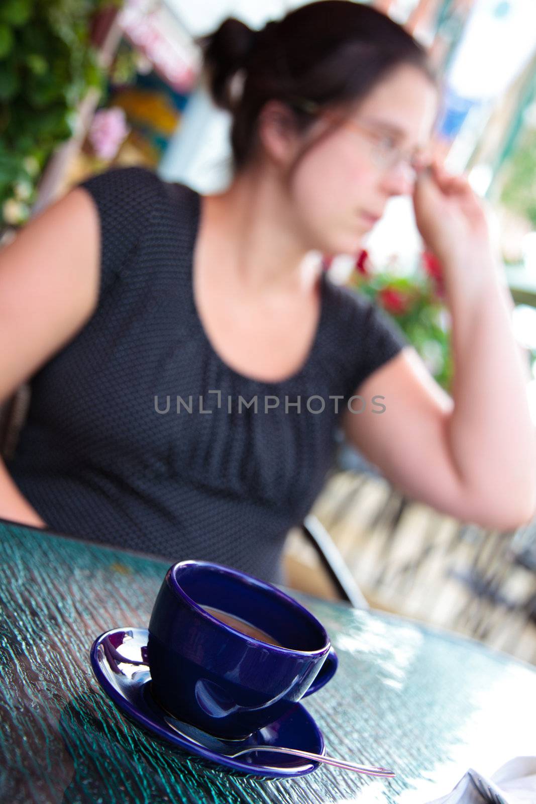 Woman having a coffee by Talanis