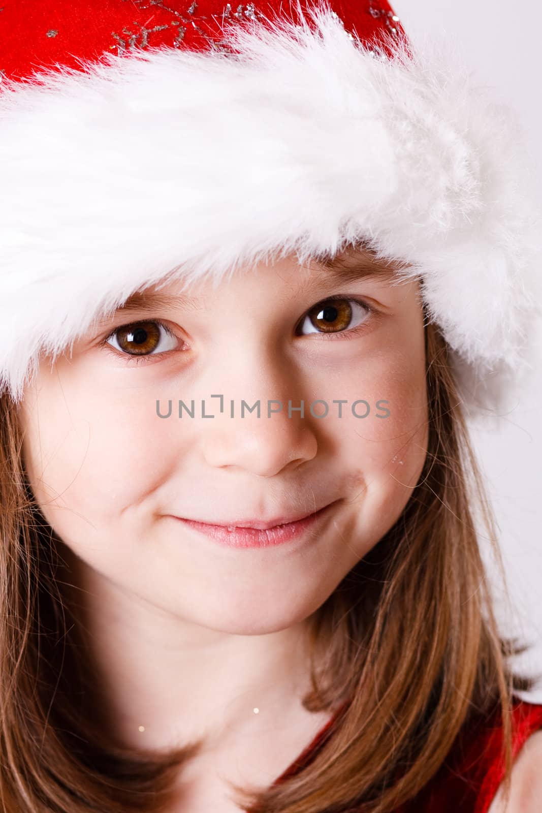 Cute little christmas girl on a white background