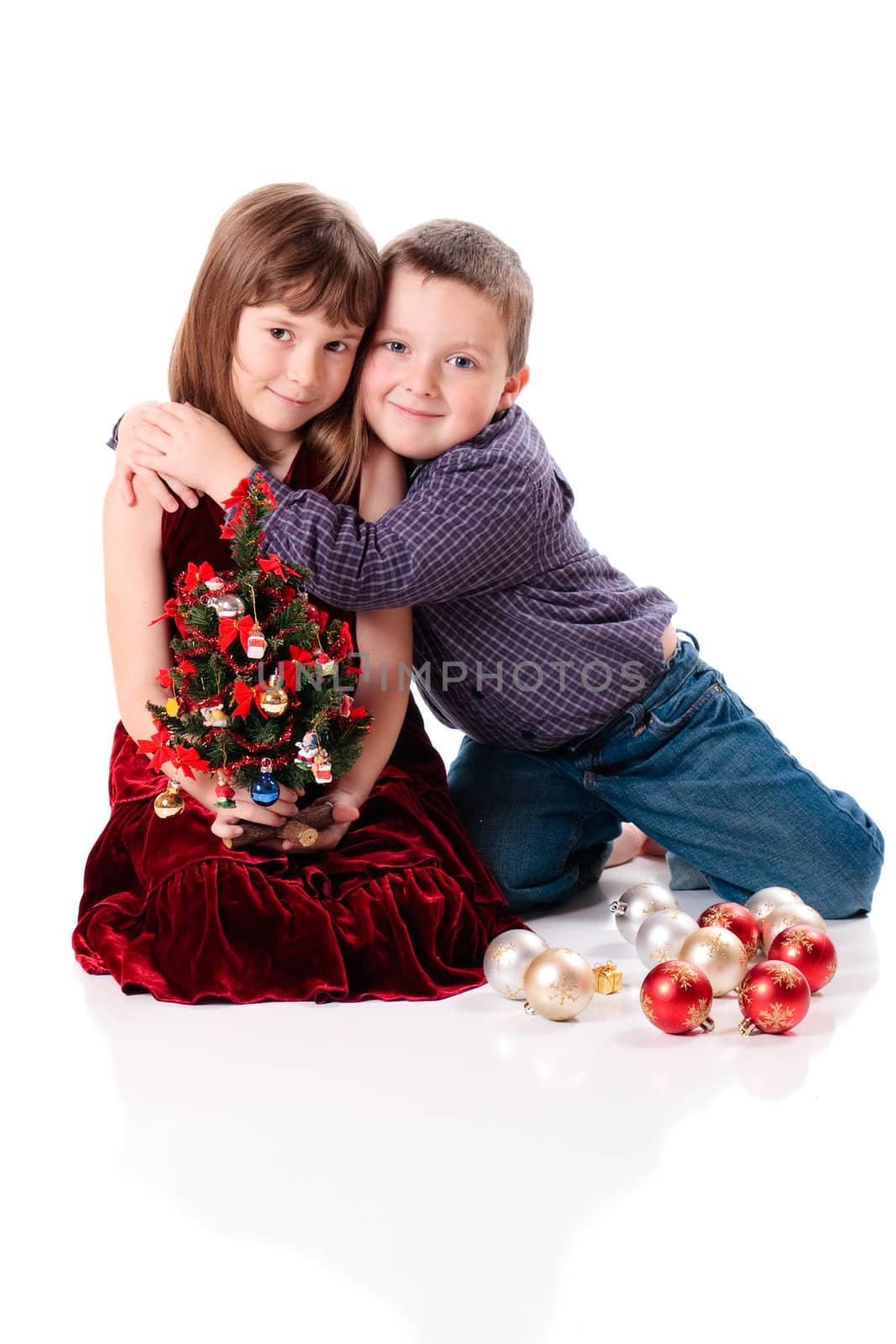 Cute little christmas couple hugging