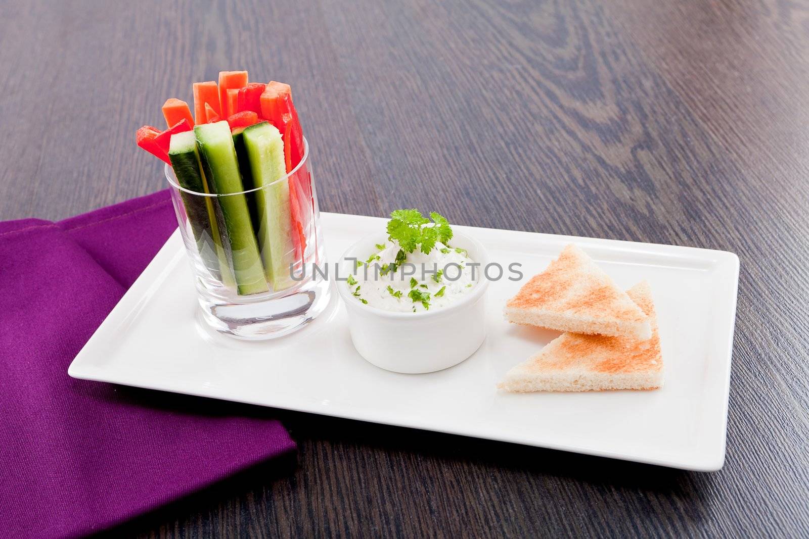 fresh vegetables snack and cream cheese dip with bread on plate