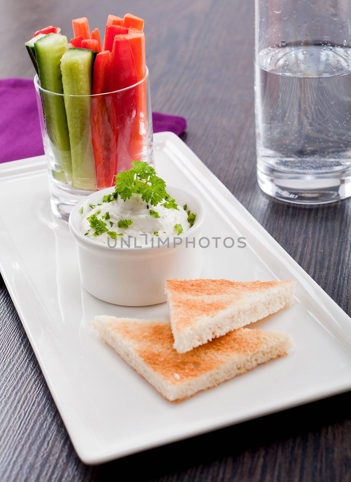 fresh vegetables snack and cream cheese dip with bread on plate