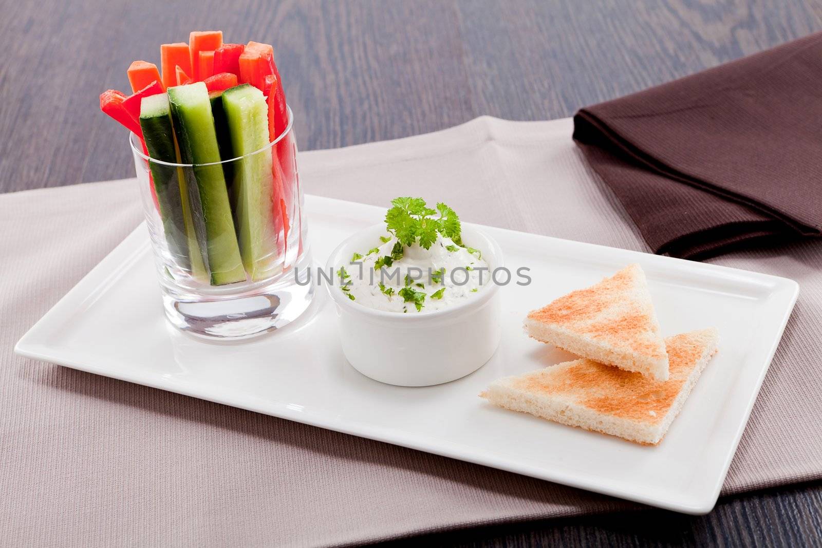 fresh vegetables snack and cream cheese dip with bread on plate