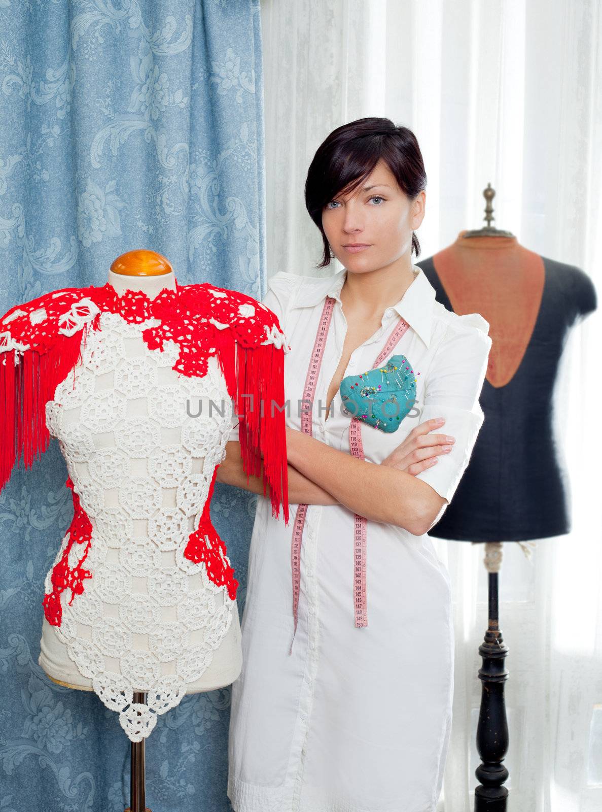 Dressmaker with mannequin as professional fashion designer