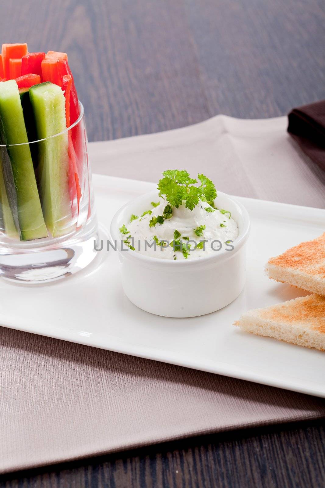 fresh vegetables snack and cream cheese dip with bread on plate