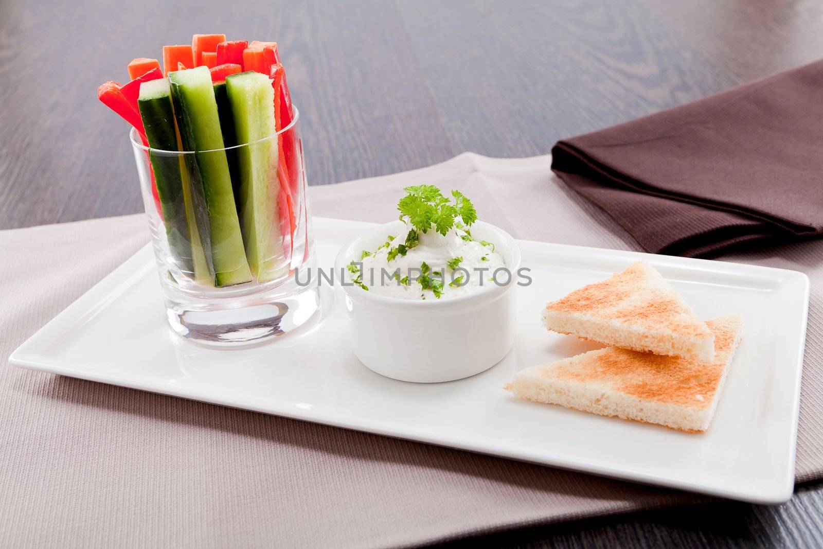 fresh vegetables snack and cream cheese dip with bread on plate