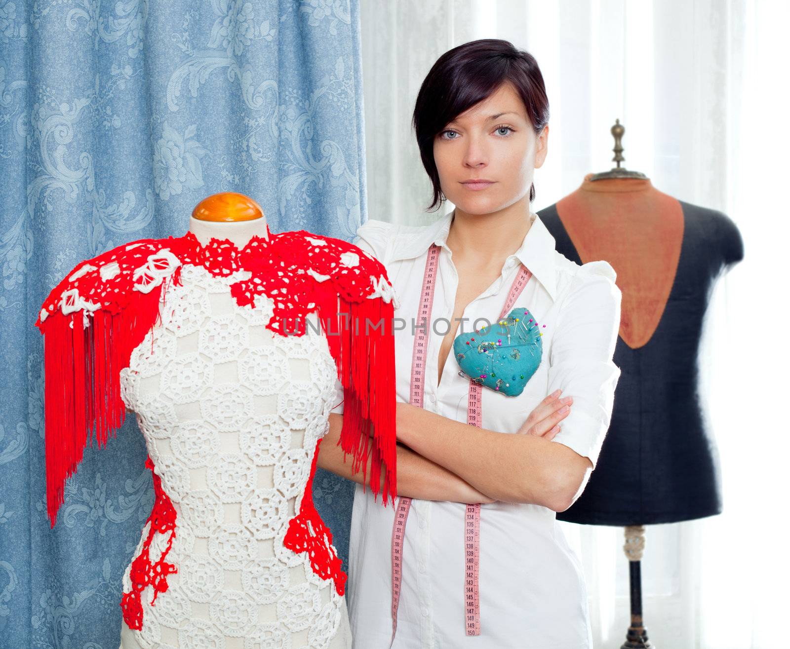 Dressmaker with mannequin as professional fashion designer