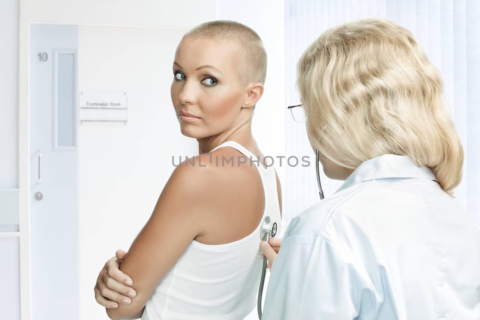 Portrait of young nice woman on medical examination by ersler