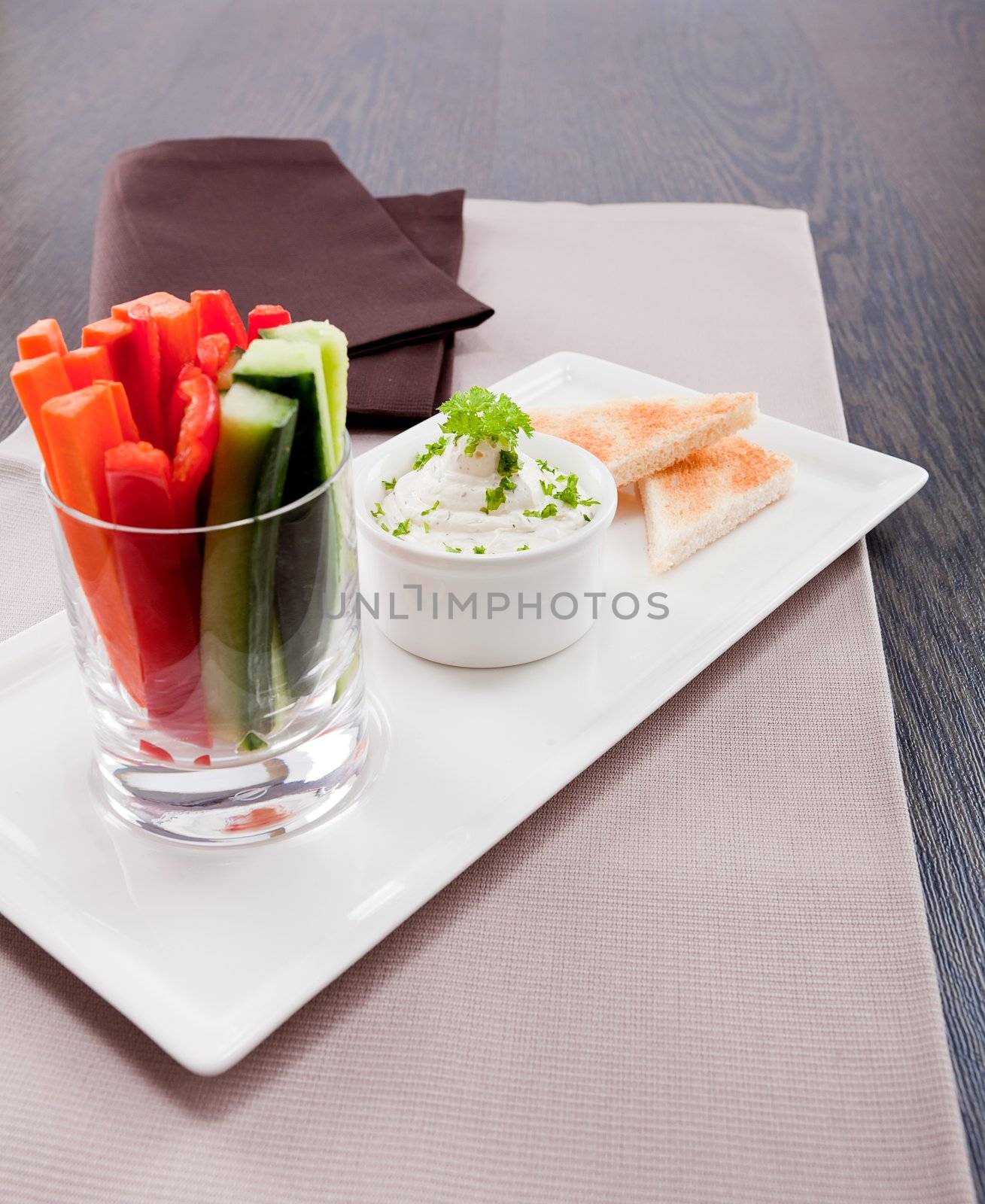 fresh vegetables snack and cream cheese dip with bread on plate