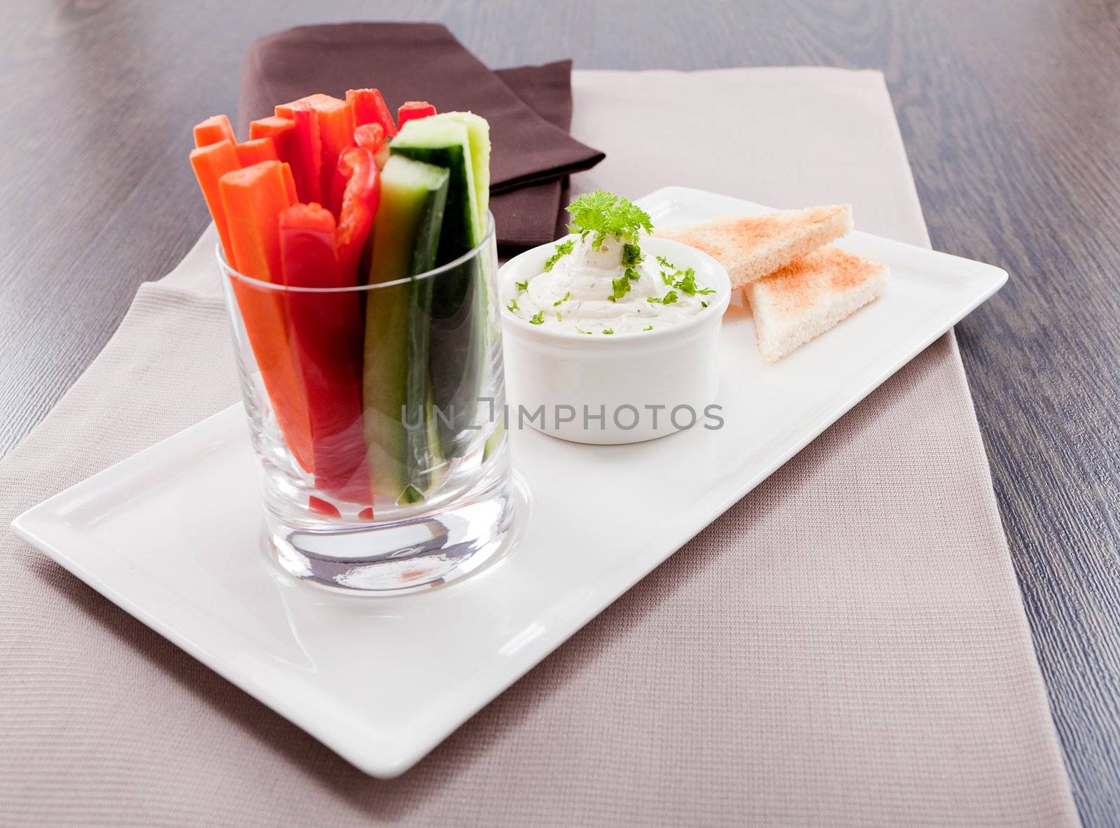 fresh vegetables snack and cream cheese dip with bread on plate