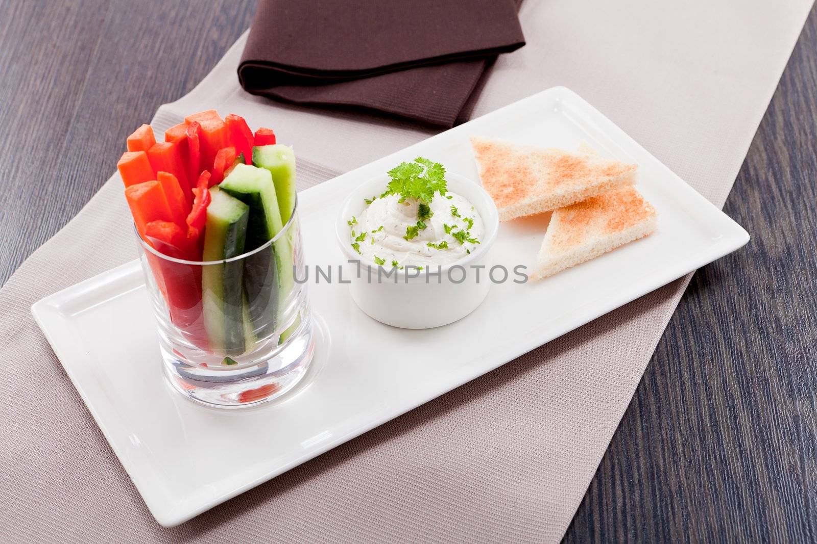 fresh vegetables snack and cream cheese dip with bread on plate