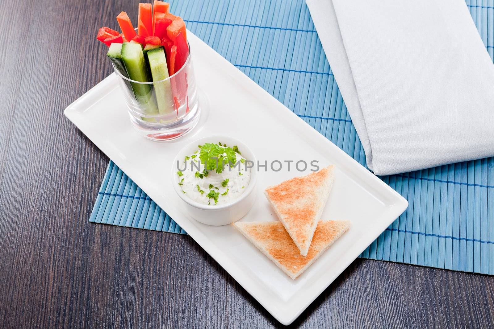 fresh vegetables snack and cream cheese dip with bread on plate