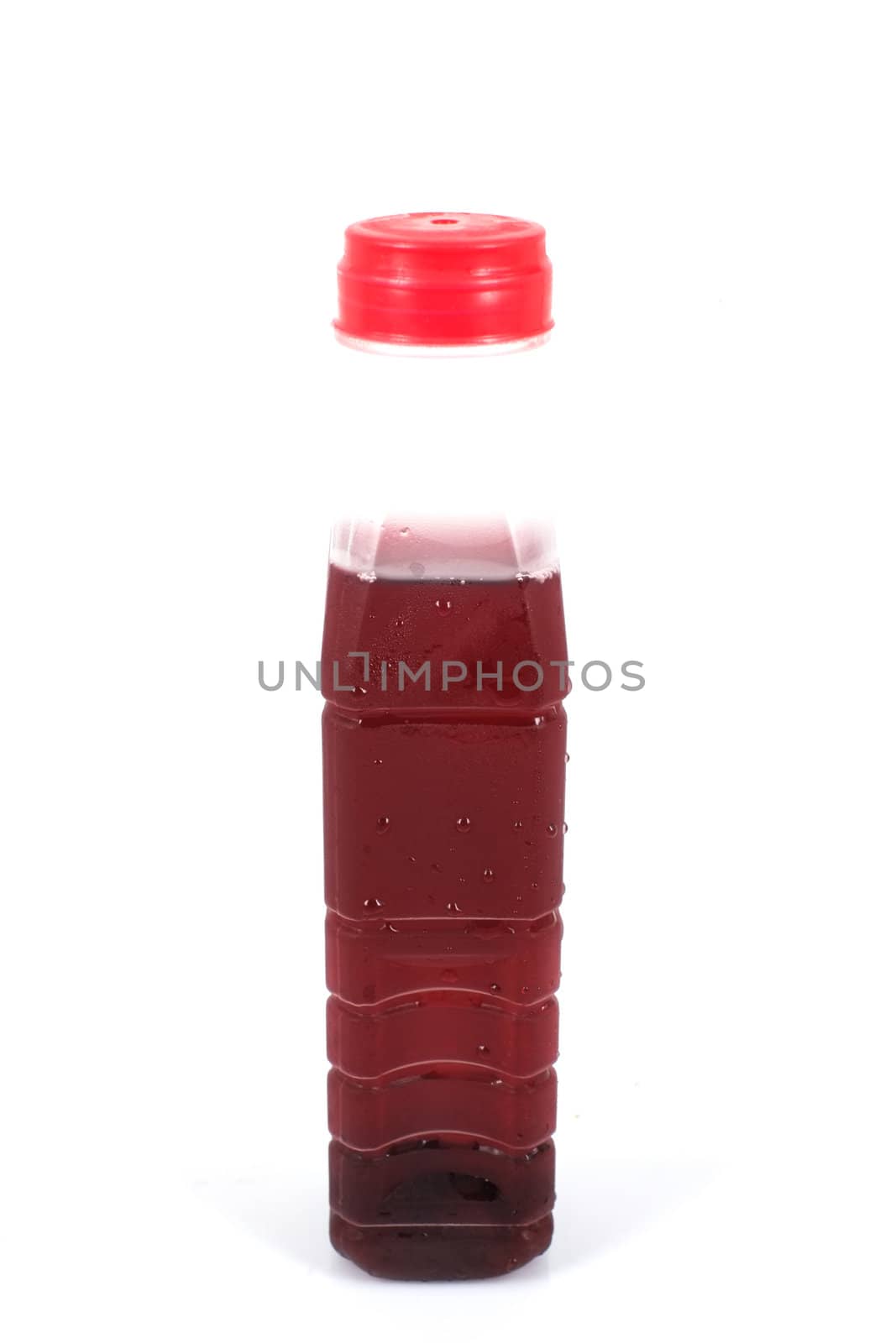 Roselle juice in plastic bottle on whiet background