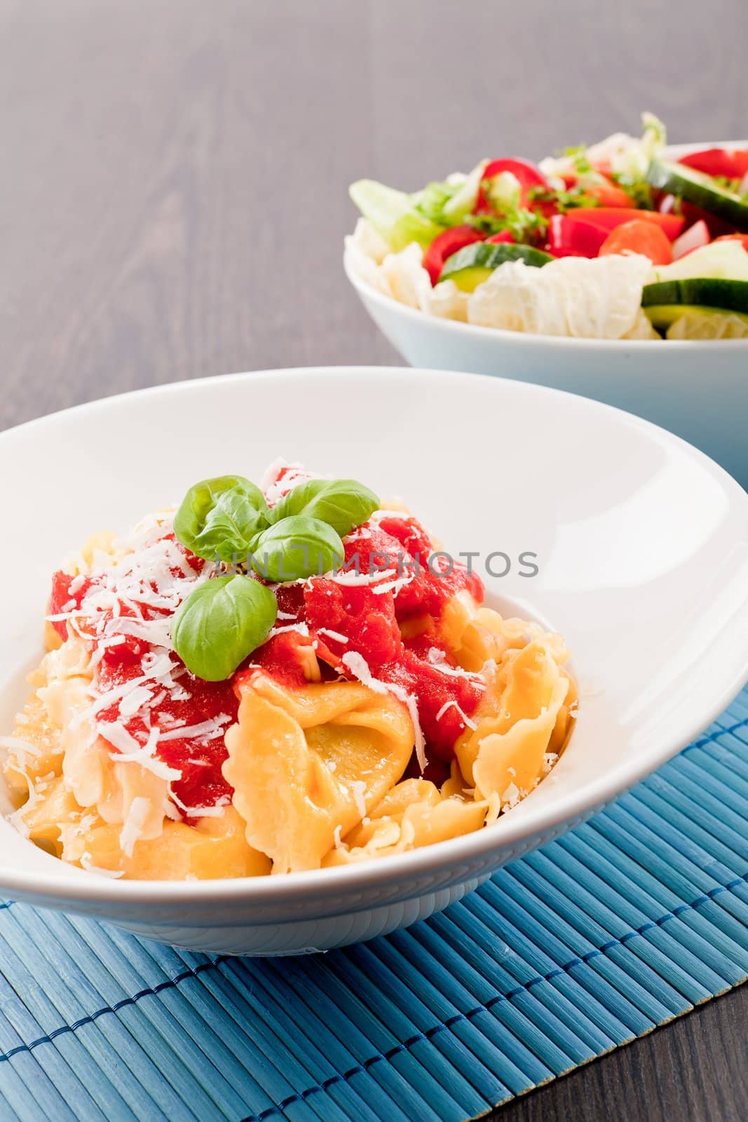 tasty fresh homemade ravioli with tomato sauce basil and parmesan