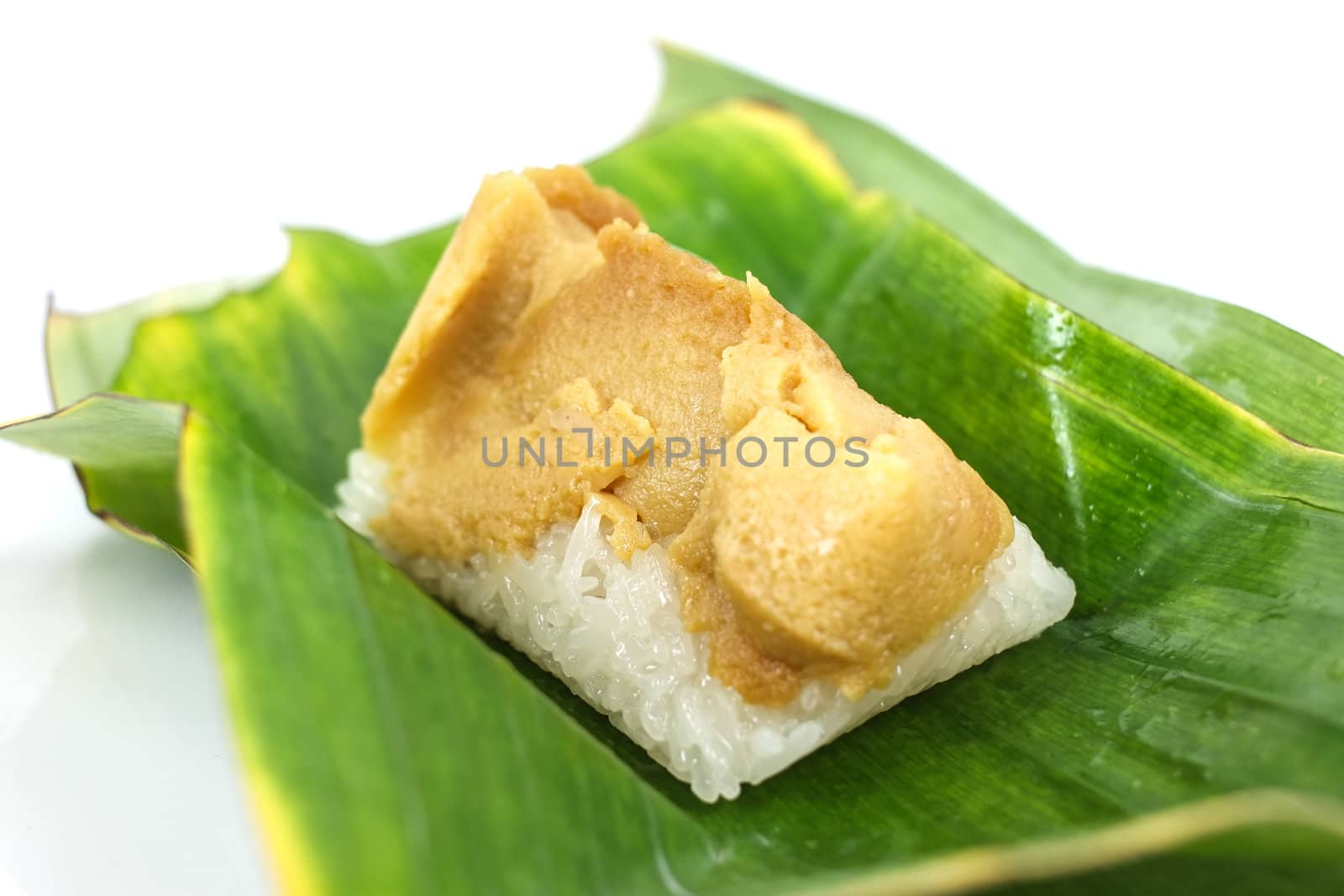 Thai dessert, Sticky rice with steamed custard, wrapped in banana leaves.