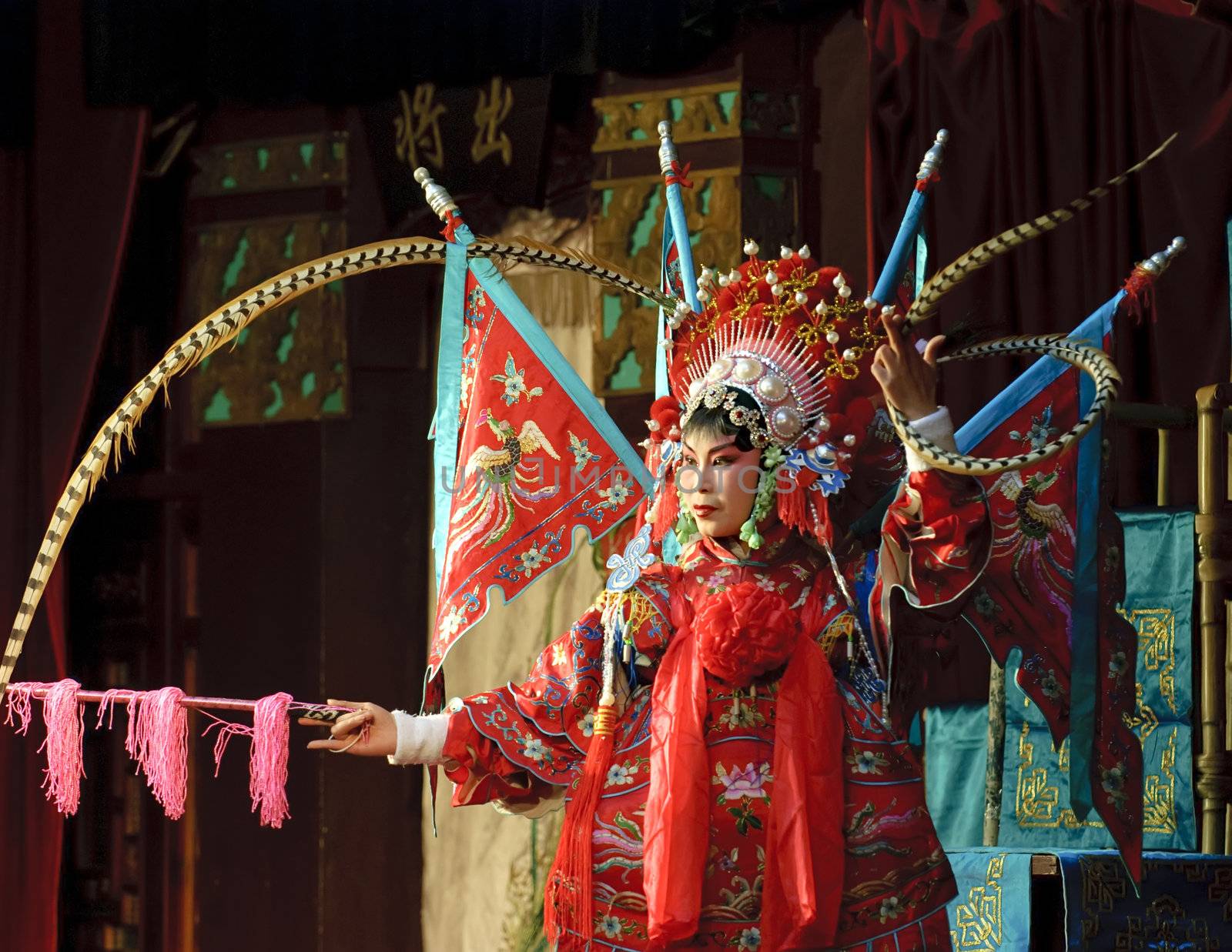 china opera actress with theatrical costume and facial painting
