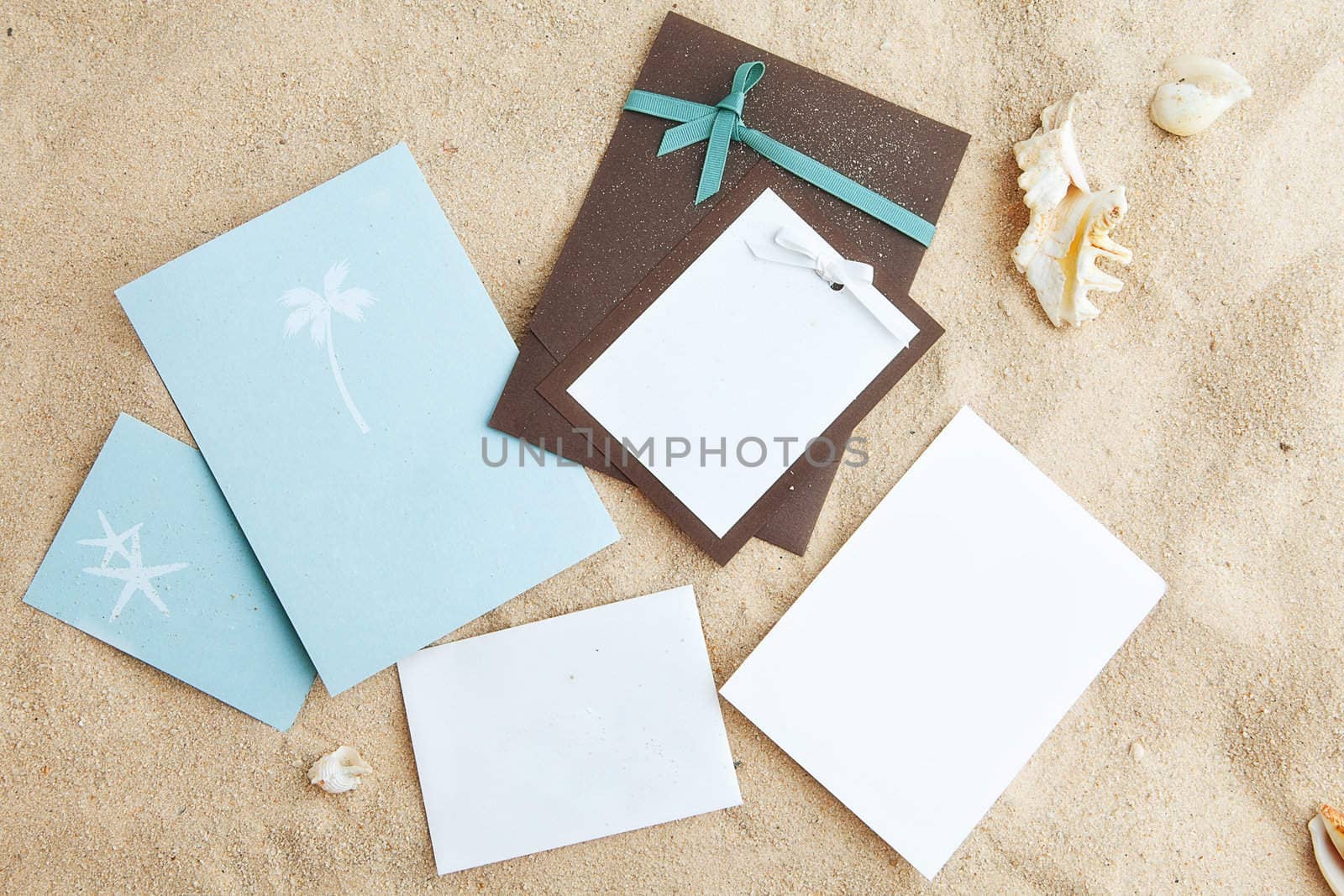 empty cards on sand. free space for your text and images. by ersler