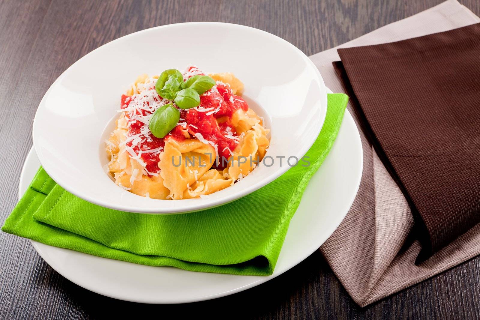 tasty fresh homemade ravioli with tomato sauce basil and parmesan