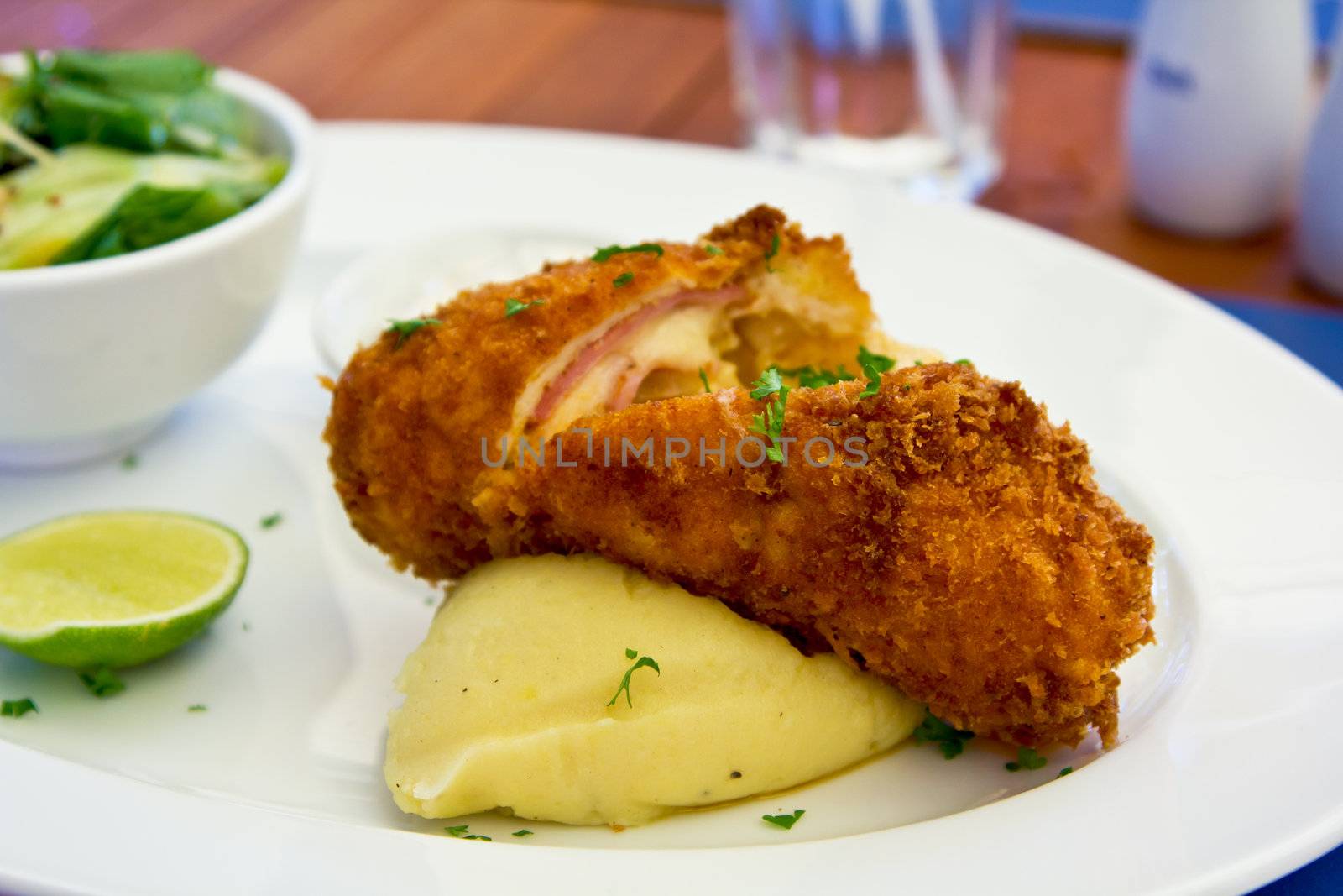 Chicken Cordon bleu with mash potato and salad