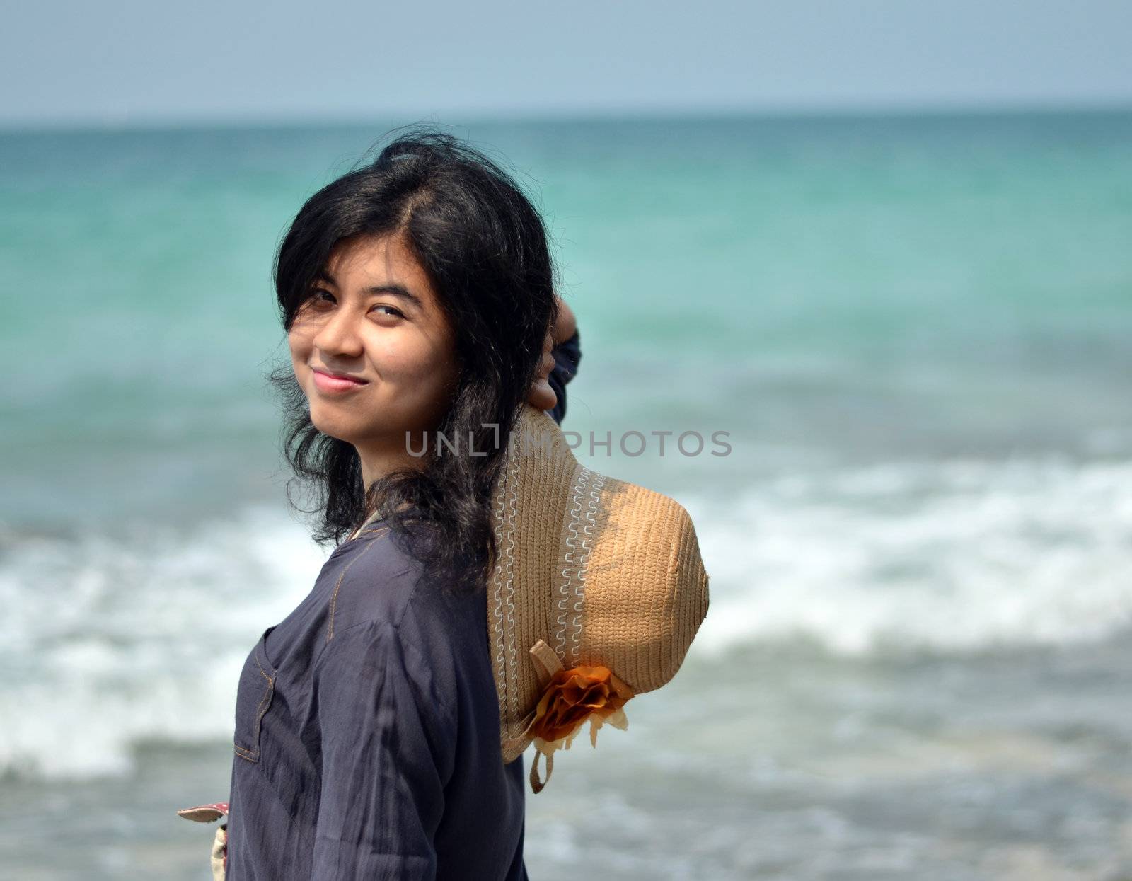 Portrait of asian woman on beach  by siraanamwong