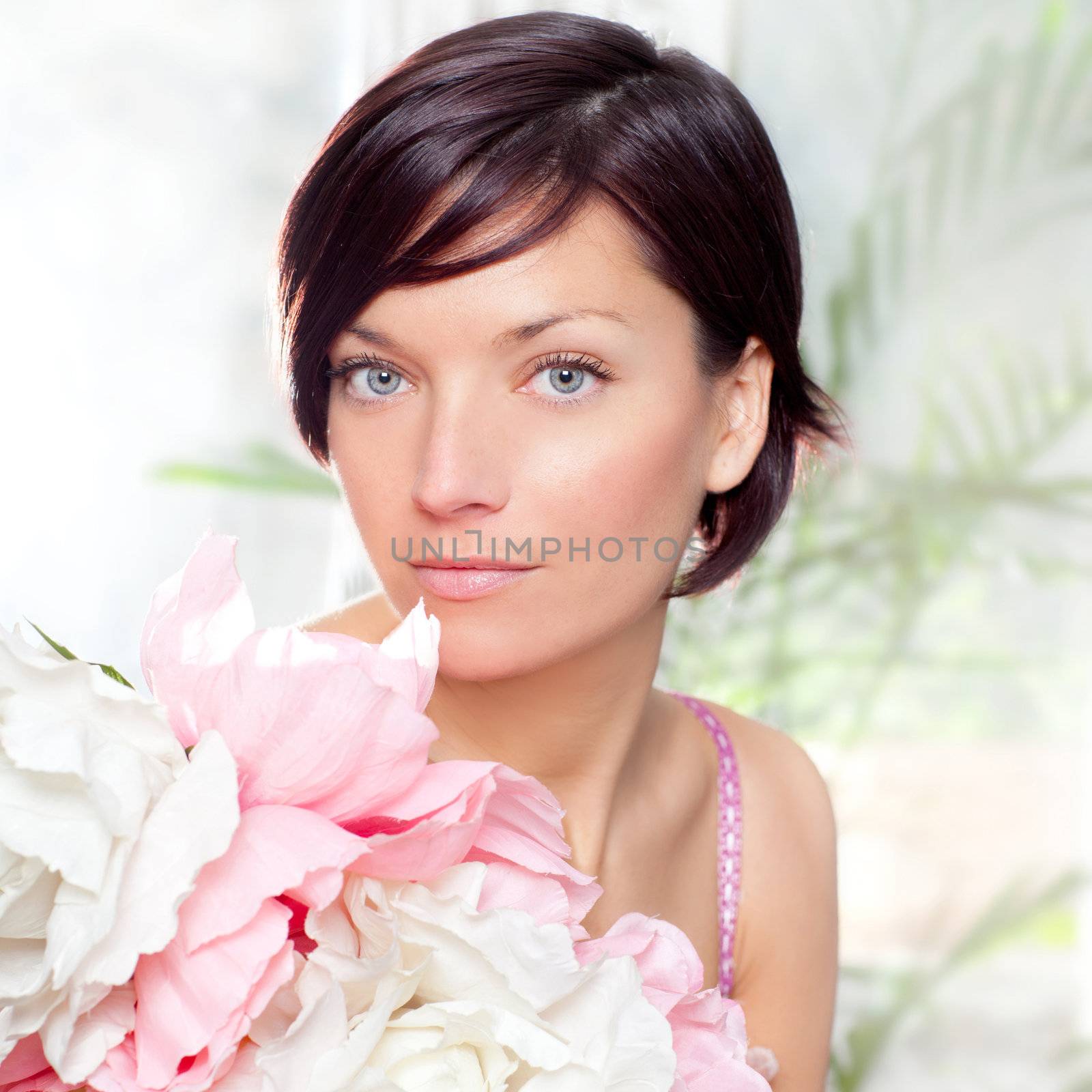 beautiful flowers woman with spring pink dress portrait