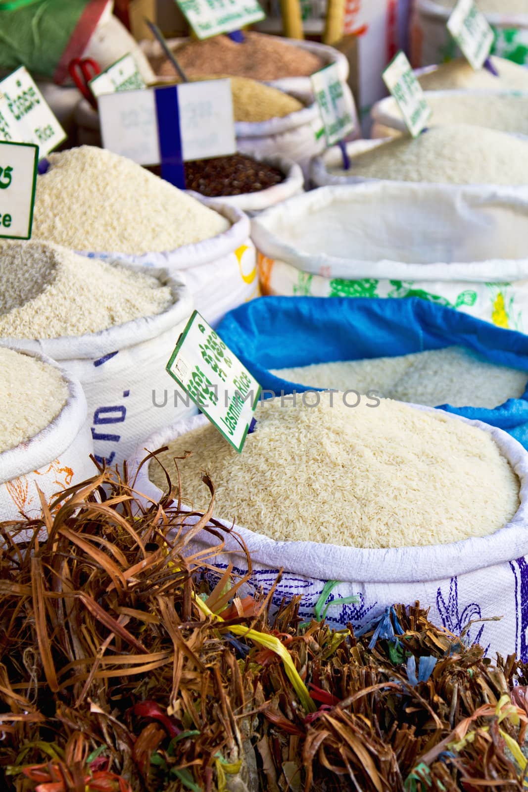 Rice stalls in a market by vanillaechoes