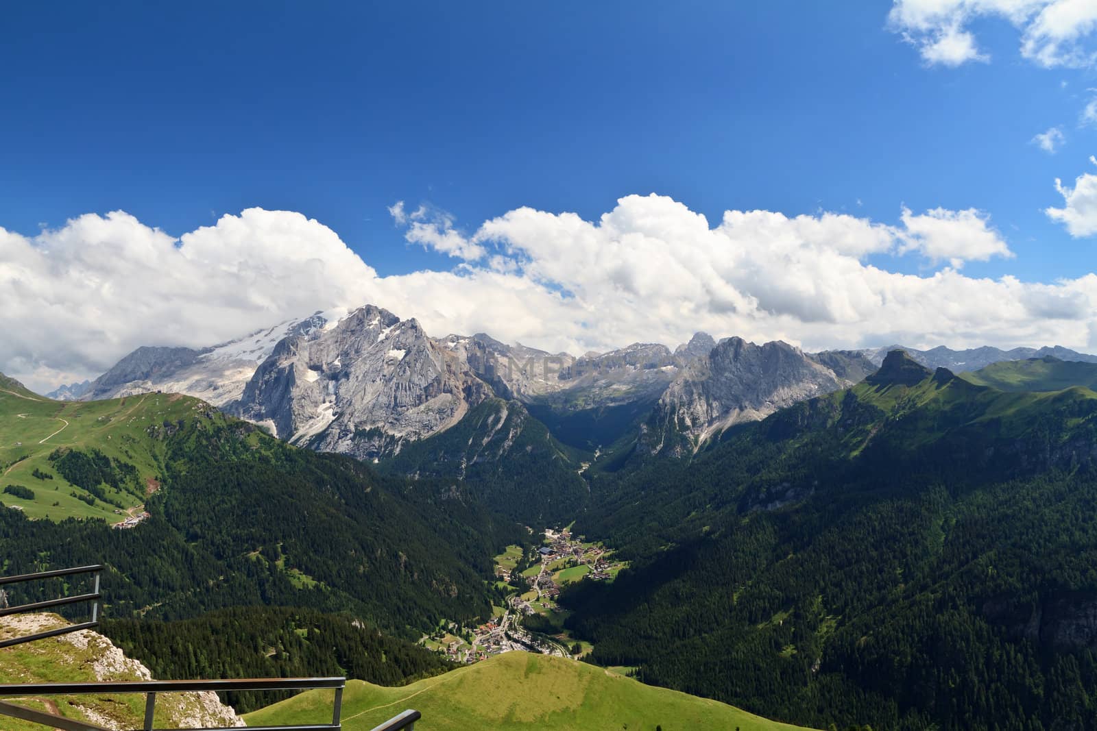 summer view of high Fassa valley with Canazei village and mount Marmolada, Italian Dolomites