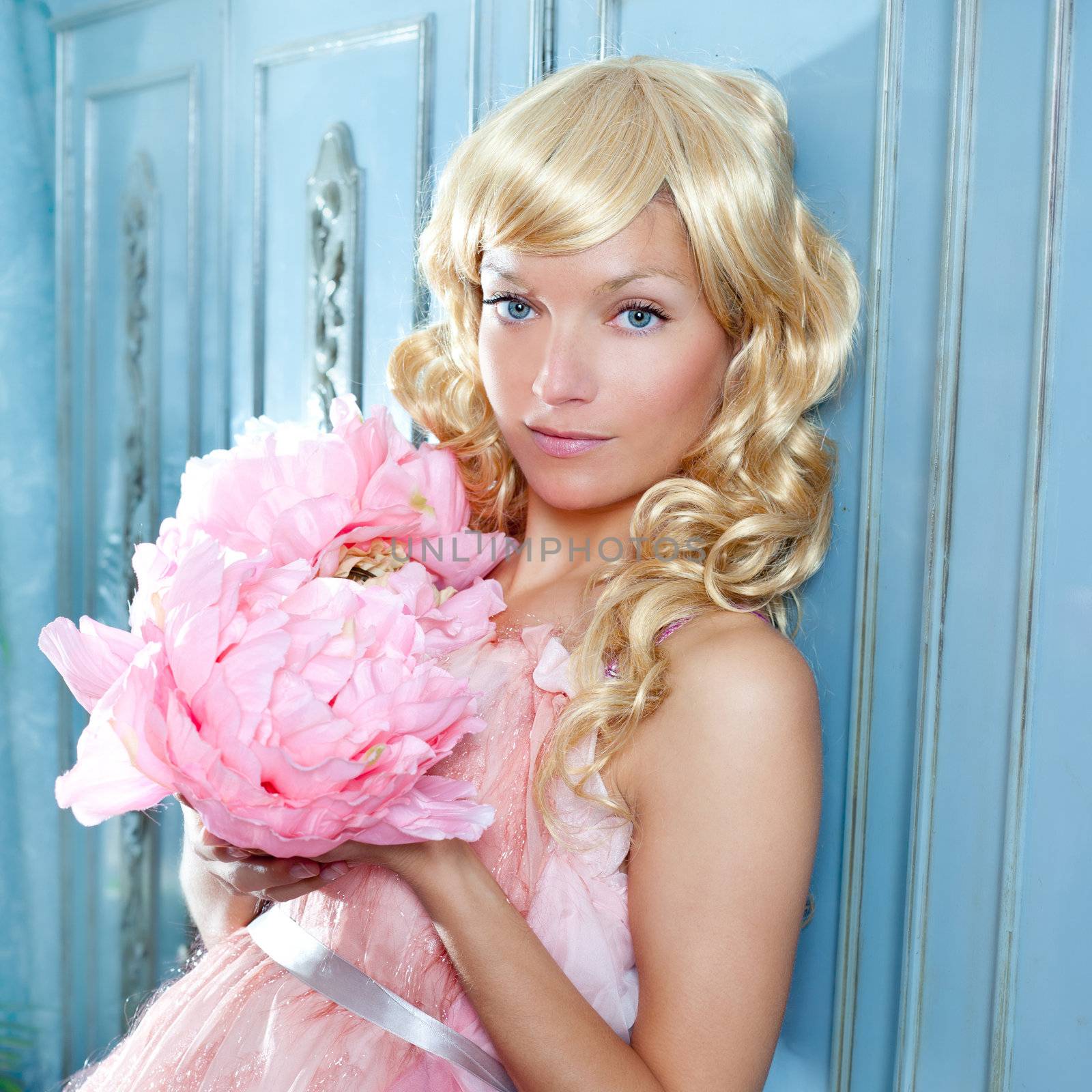 blond fashion princess and vintage spring flowers dress on blue wardrobe