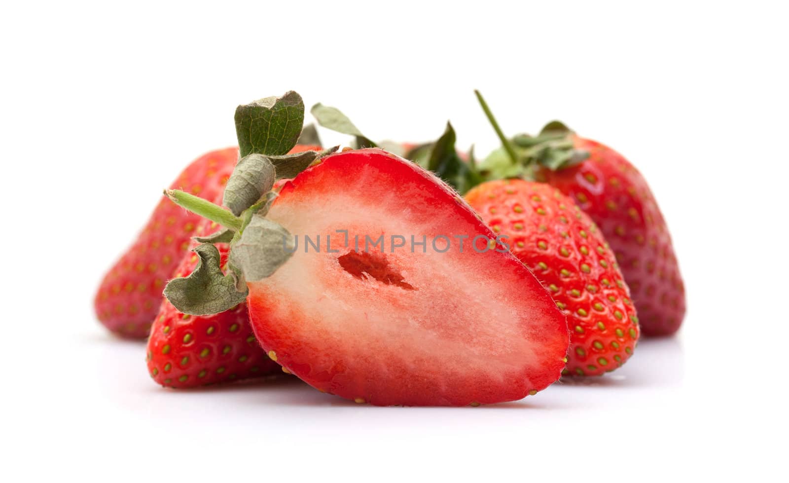 Strawberries closeup over white background