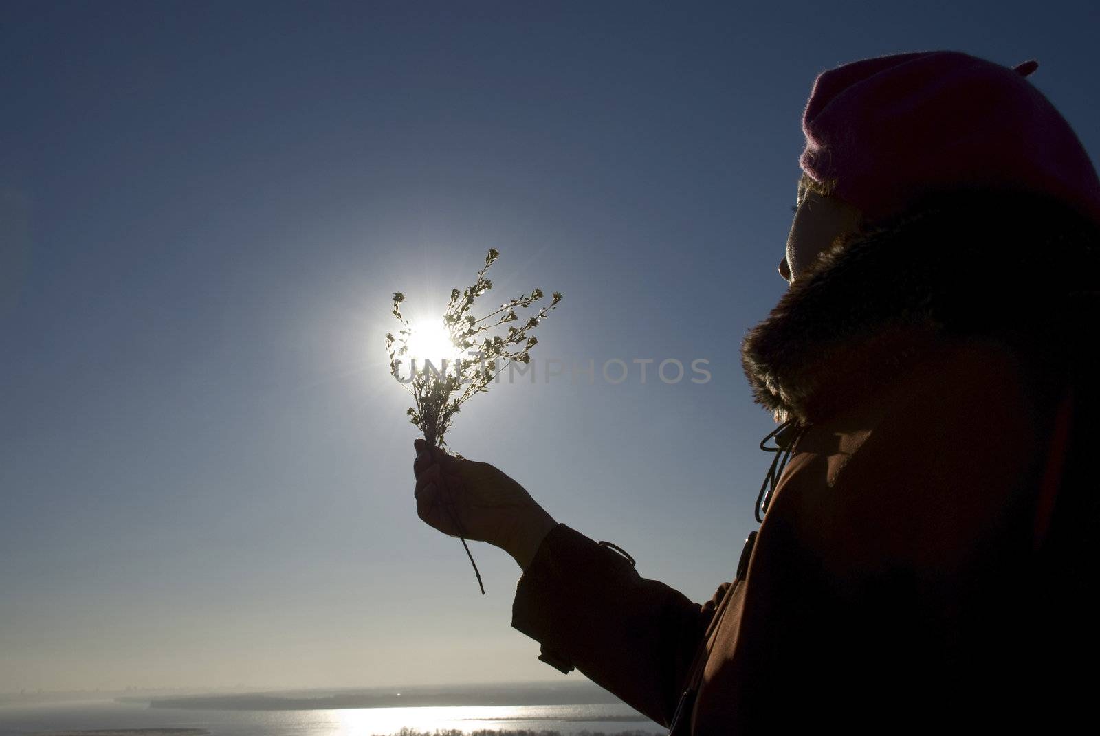 woman with a flower in the sun