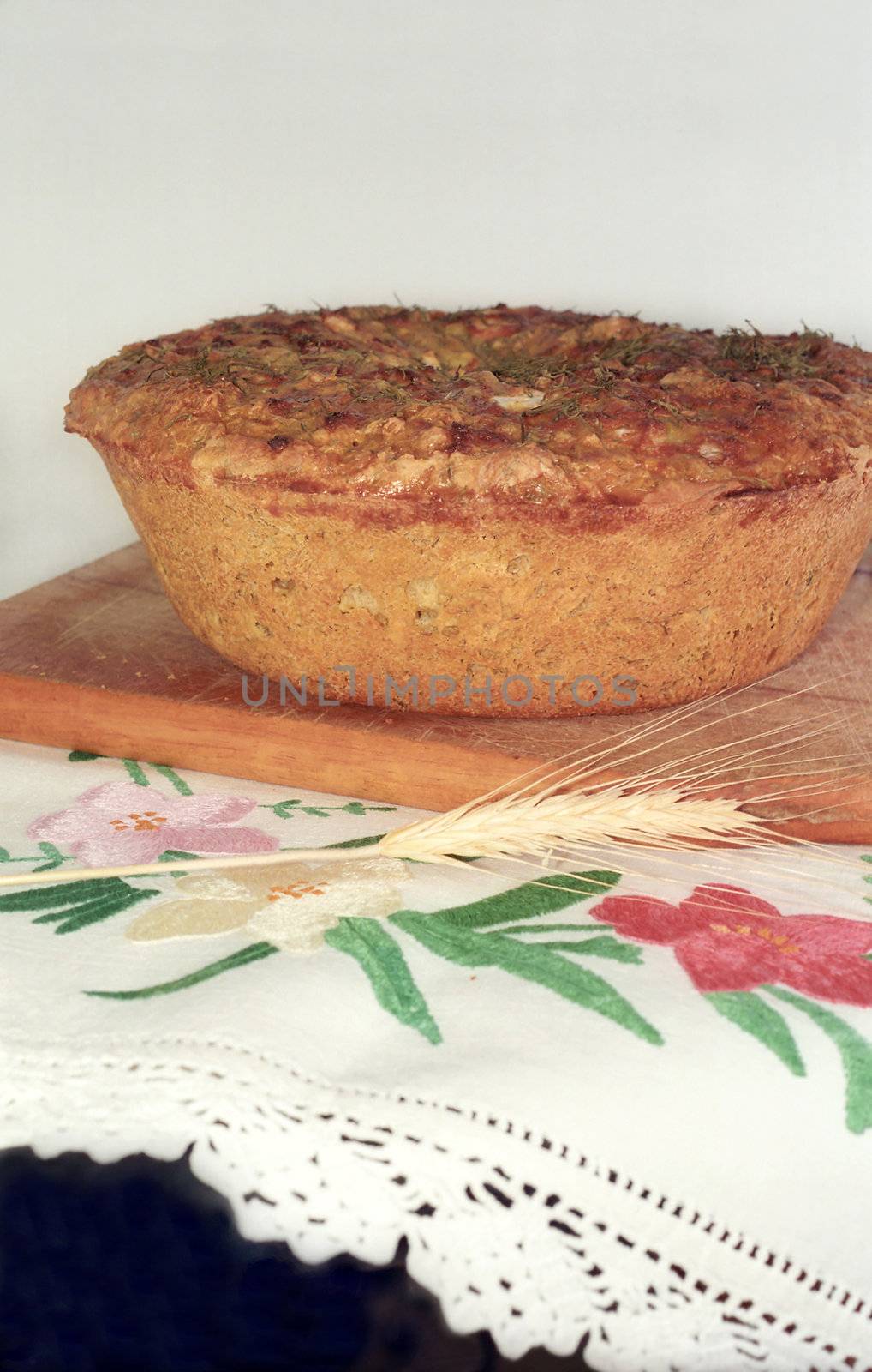 Loaf of feta cheese bread on the breadboard by mulden