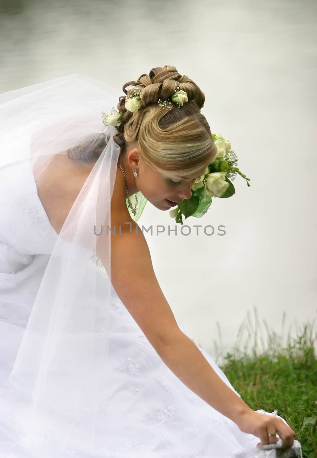 Portrait of the beautiful bride with a bouquet