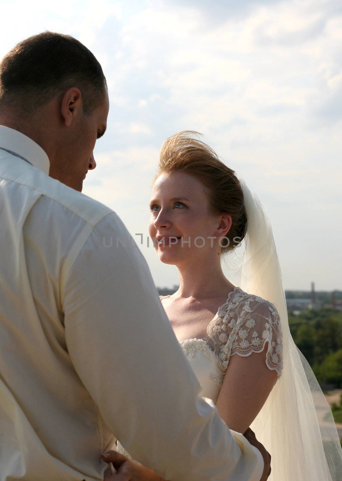 The bride looks in the face to the groom