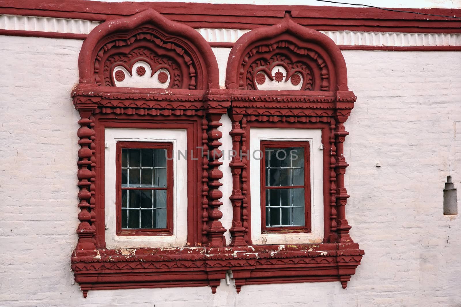 Old windows in the merchant mansion, a brick