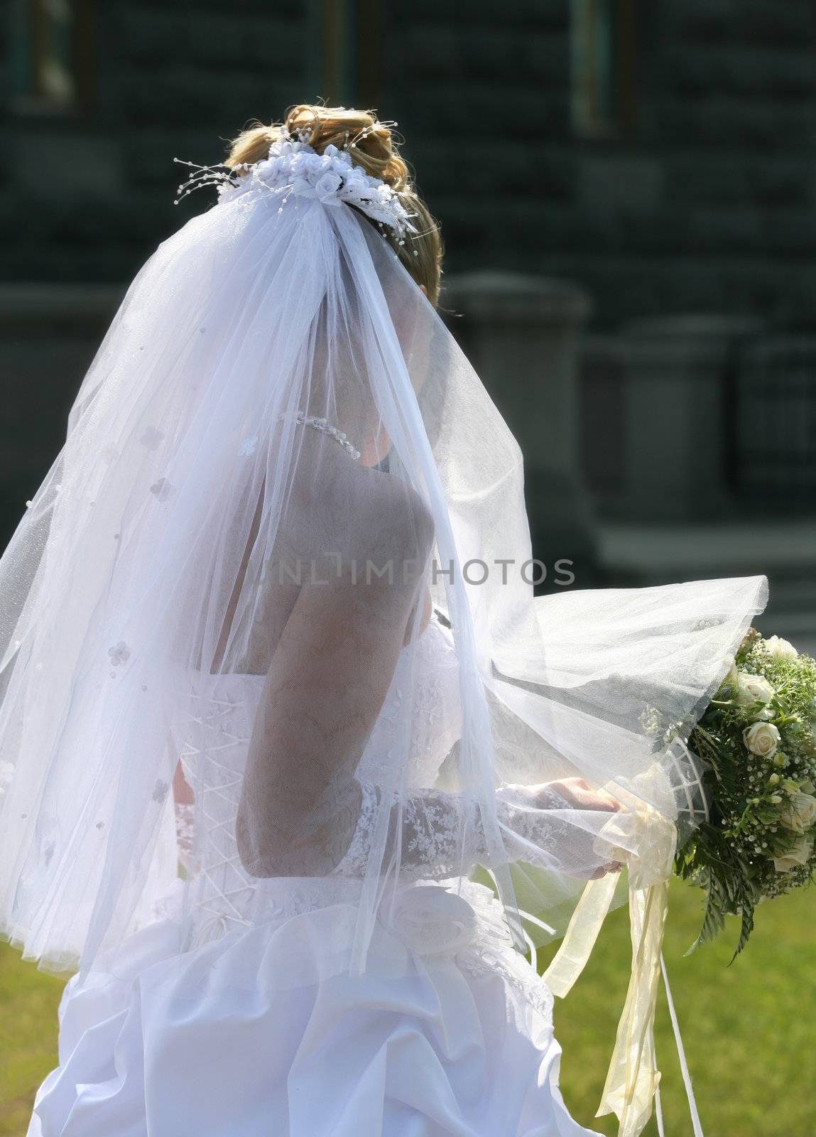 The beautiful bride with a bouquet from roses
