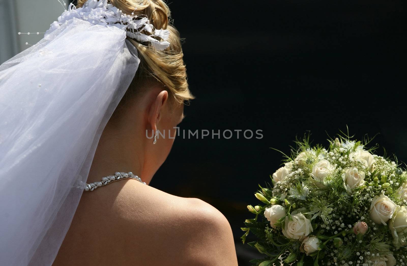 The bride with a bouquet on a dark background