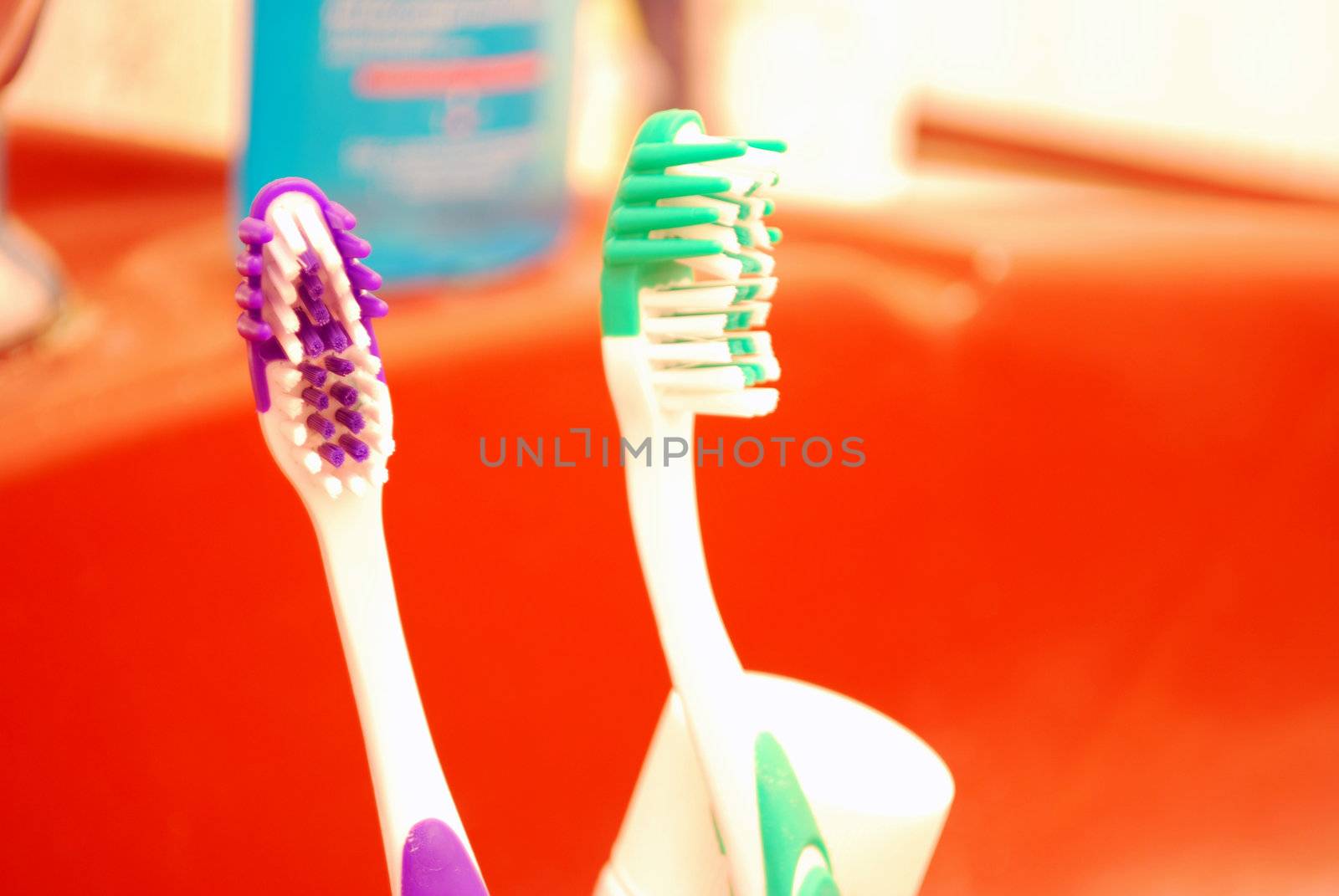 Close Up Of two Tooth Brushes in bathroom