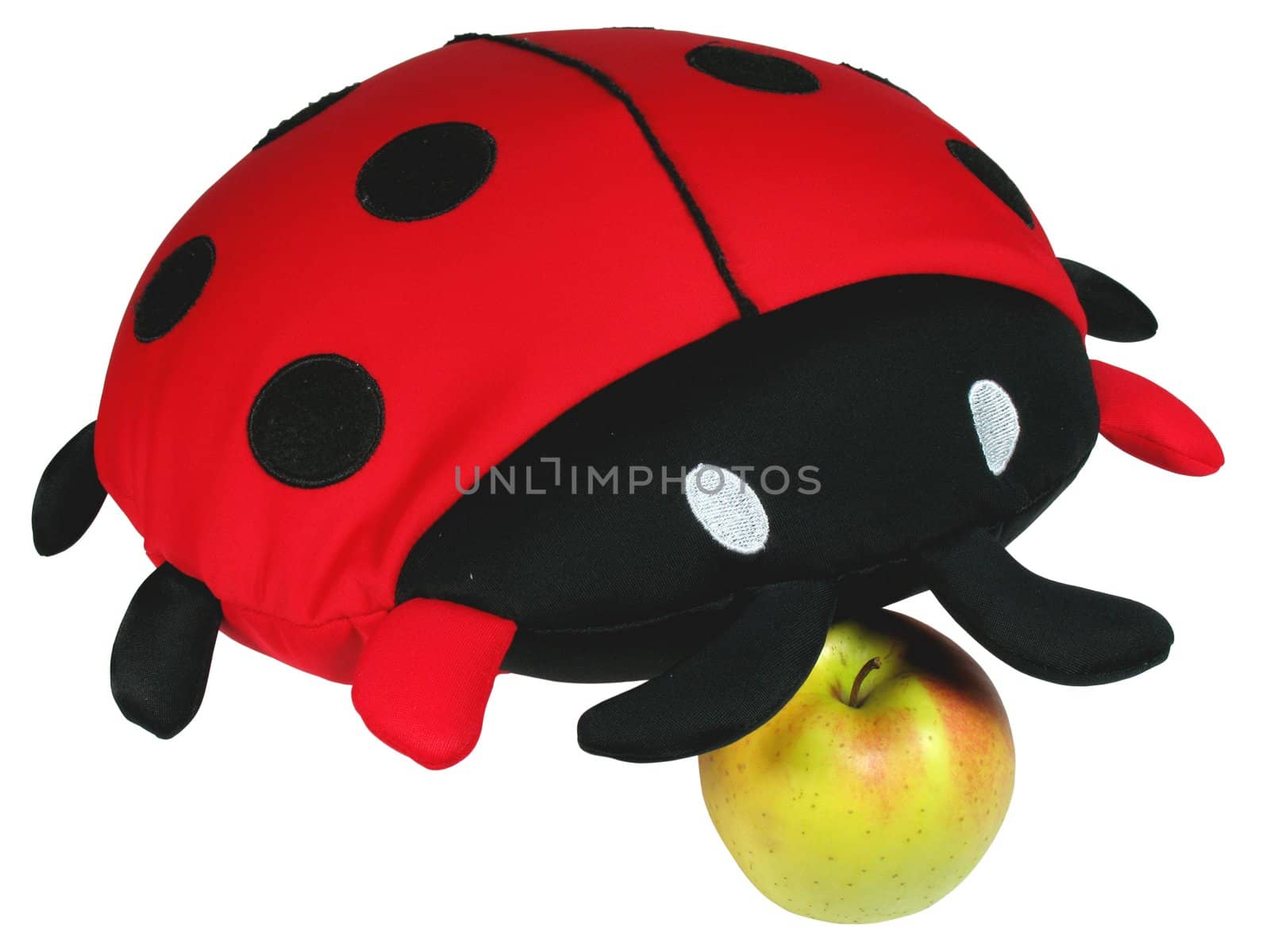 Isolated red ladybird doll with yellow apple