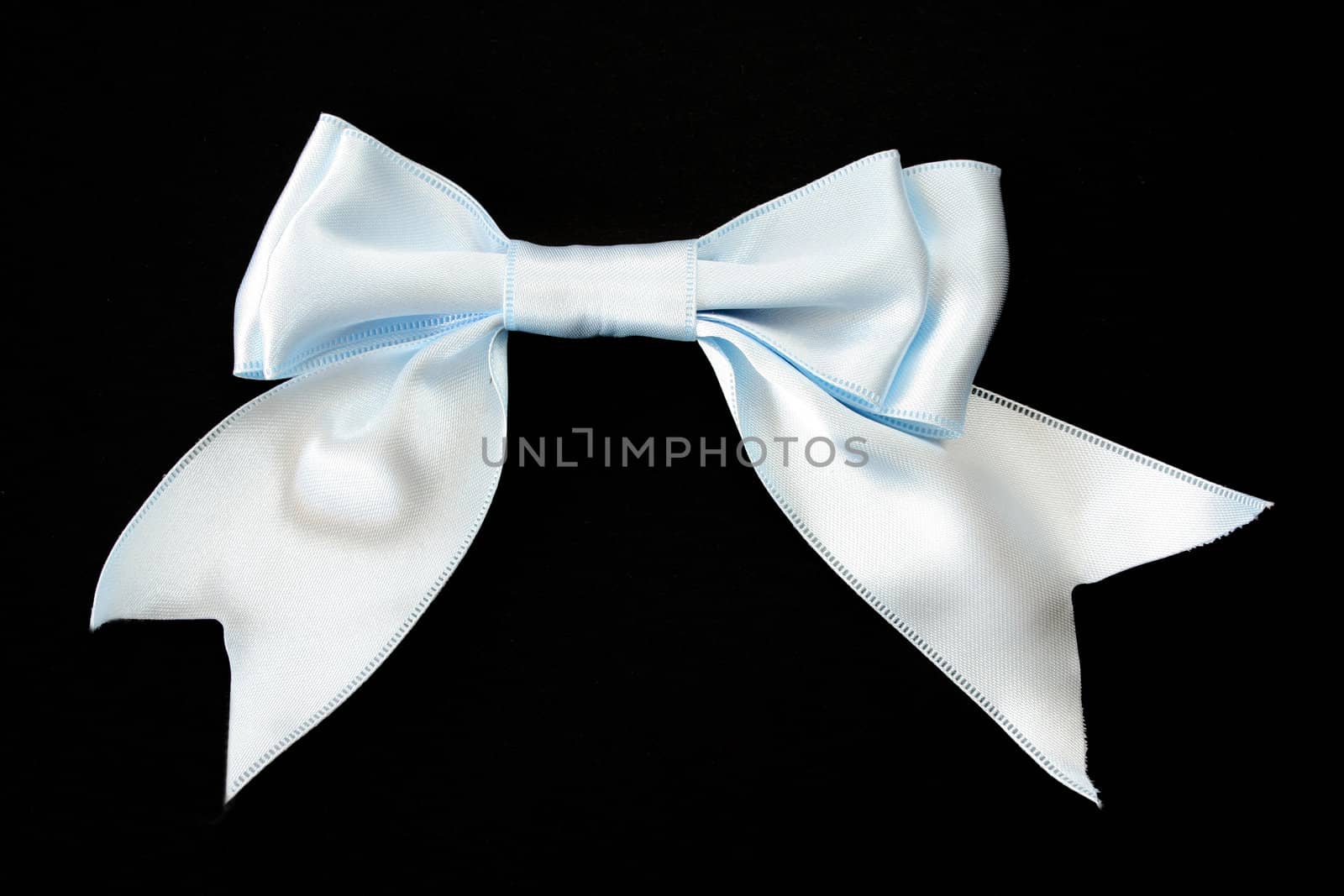 Baby blue bow on a black background.