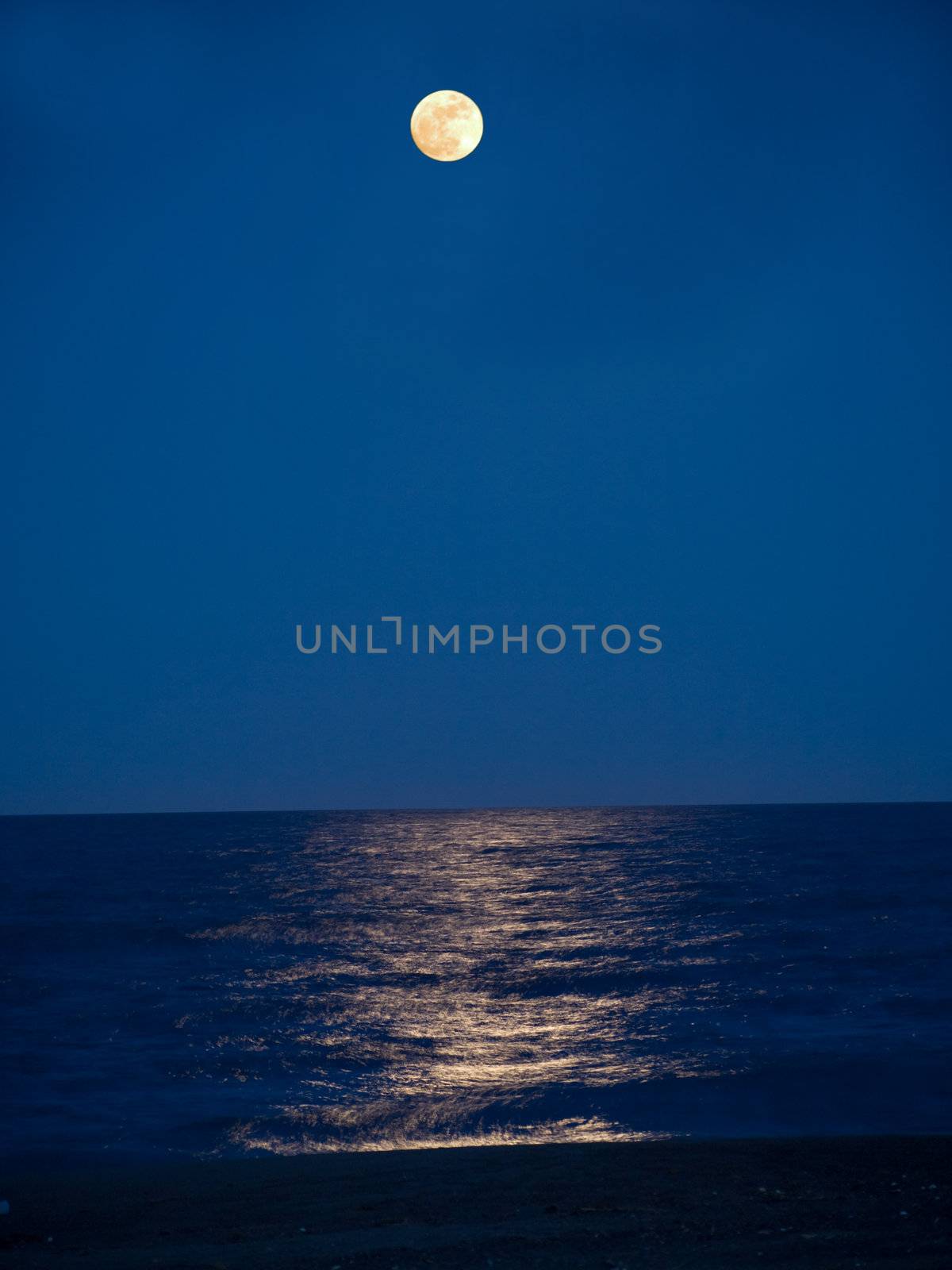 Full moon reflecting in a still sea