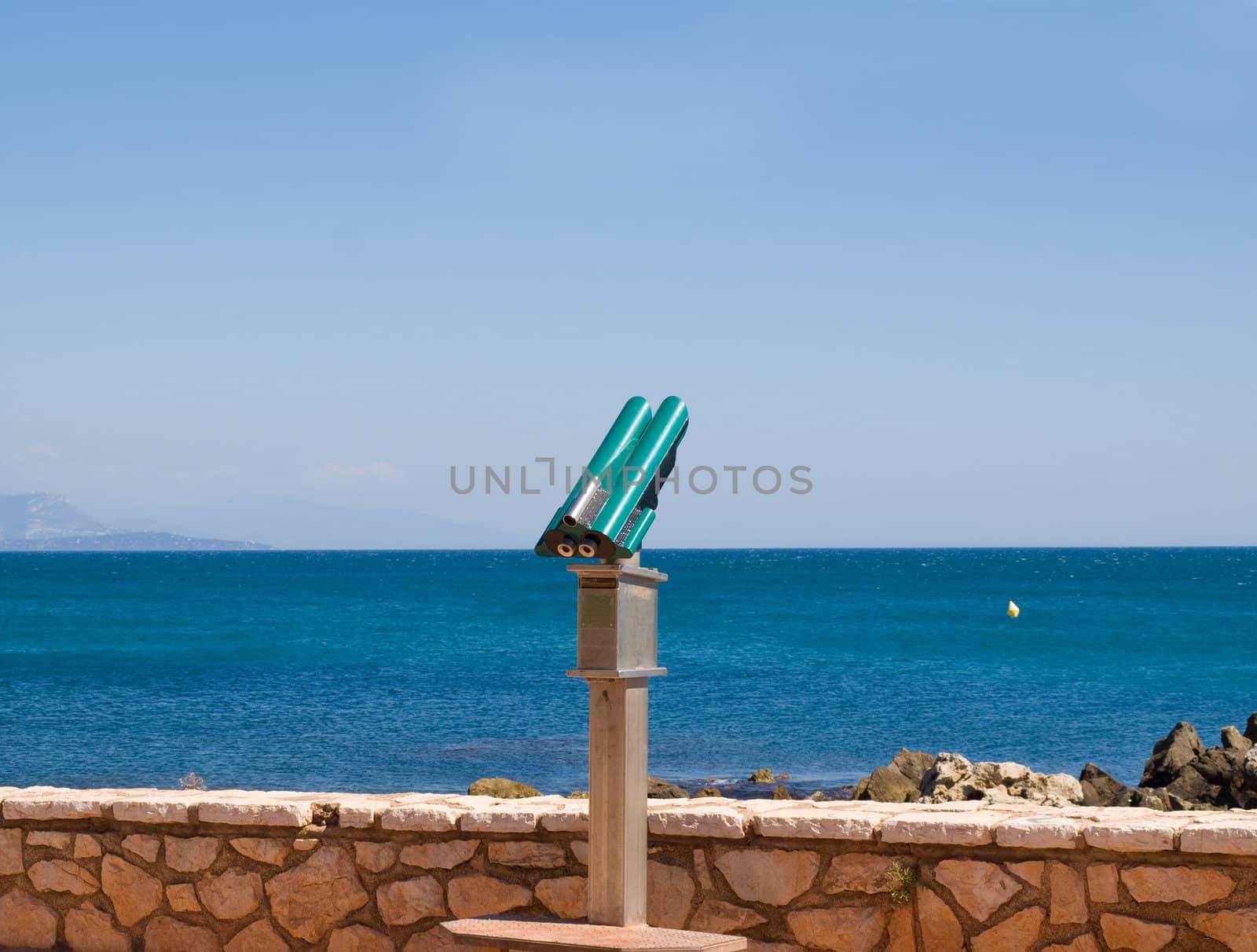 Telescope near a wall looking out to sea