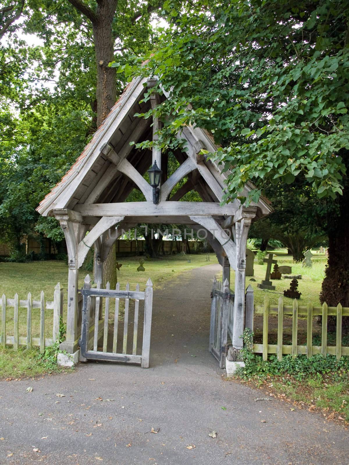 Old arched gateway into church graveyard