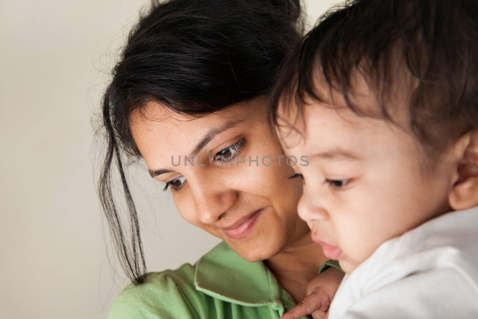 Indian Happy mother and baby looking at others