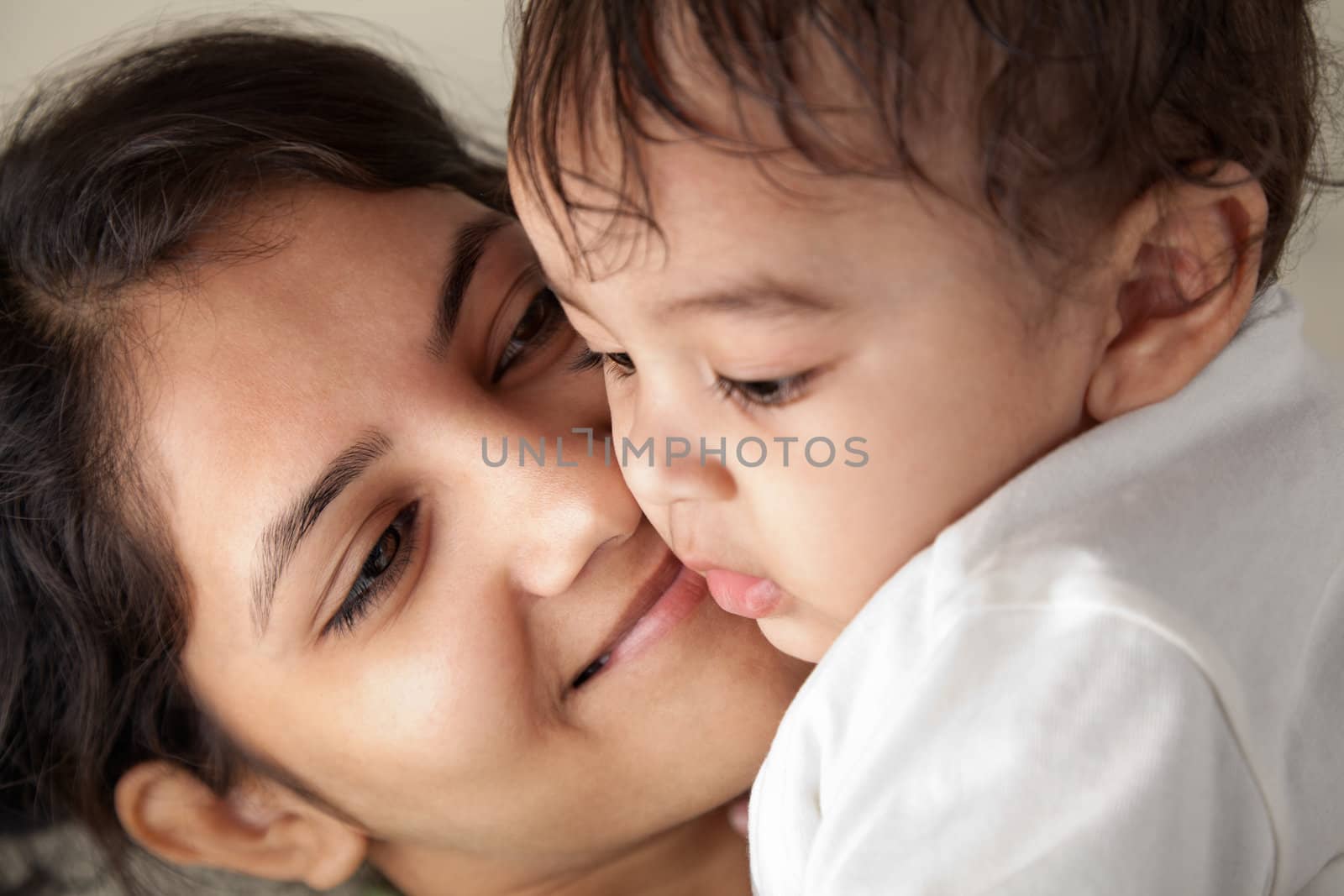 Indian Happy mother and baby looking at others