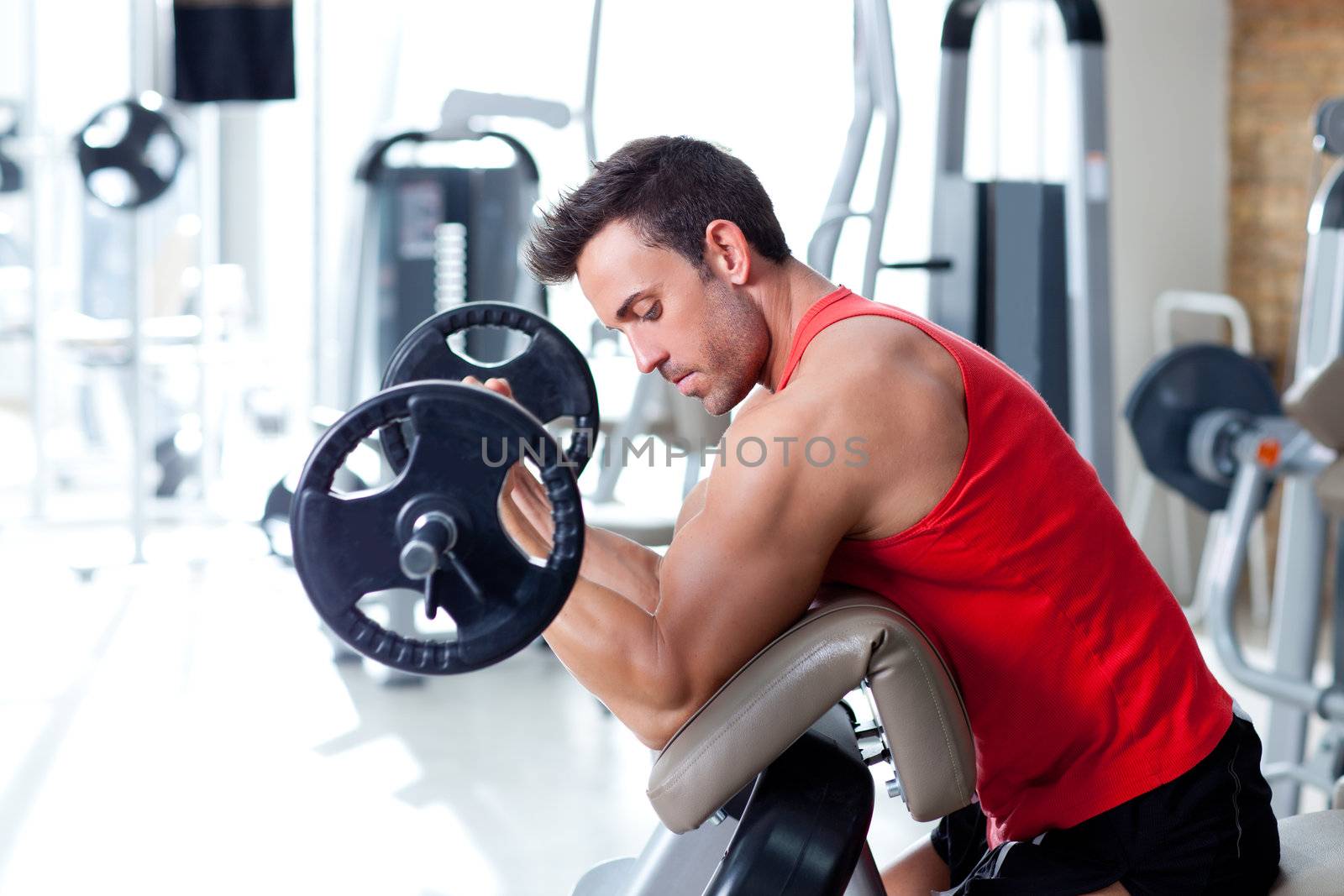 man with weight training equipment on sport gym club