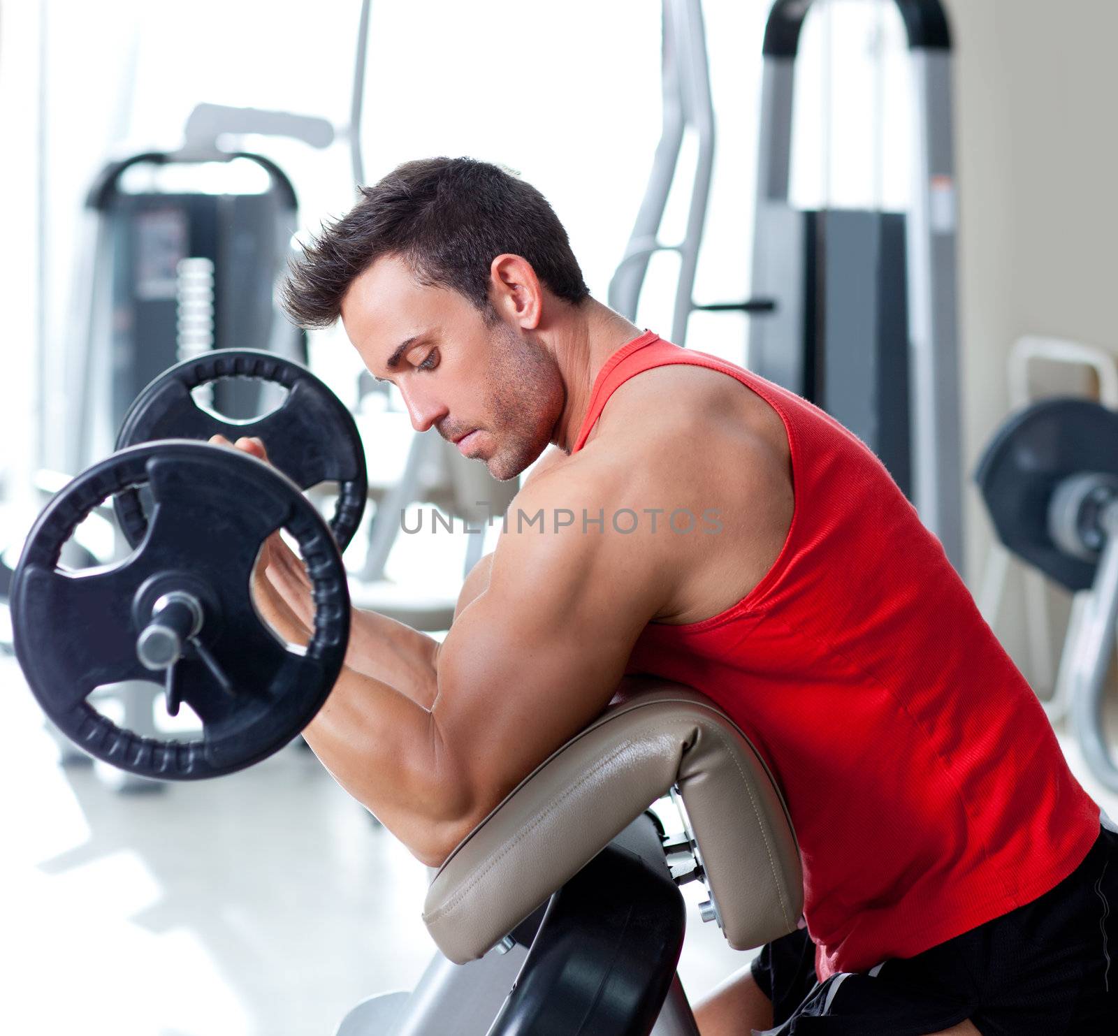 man with weight training equipment on sport gym club